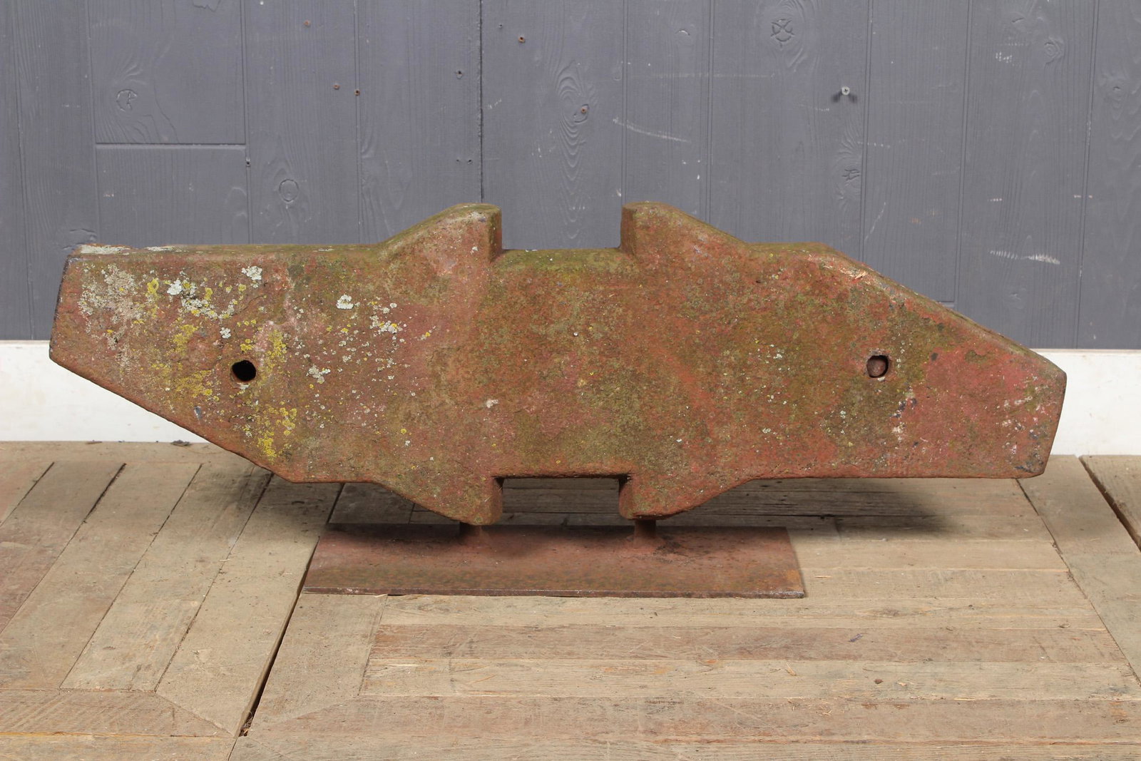 Janus Form Steel Ingot Found Object Sculpture: Early 20th century steel ingot in the form of a Janus form mounted on stand. Size: 13" H x 35" W x 7" D
