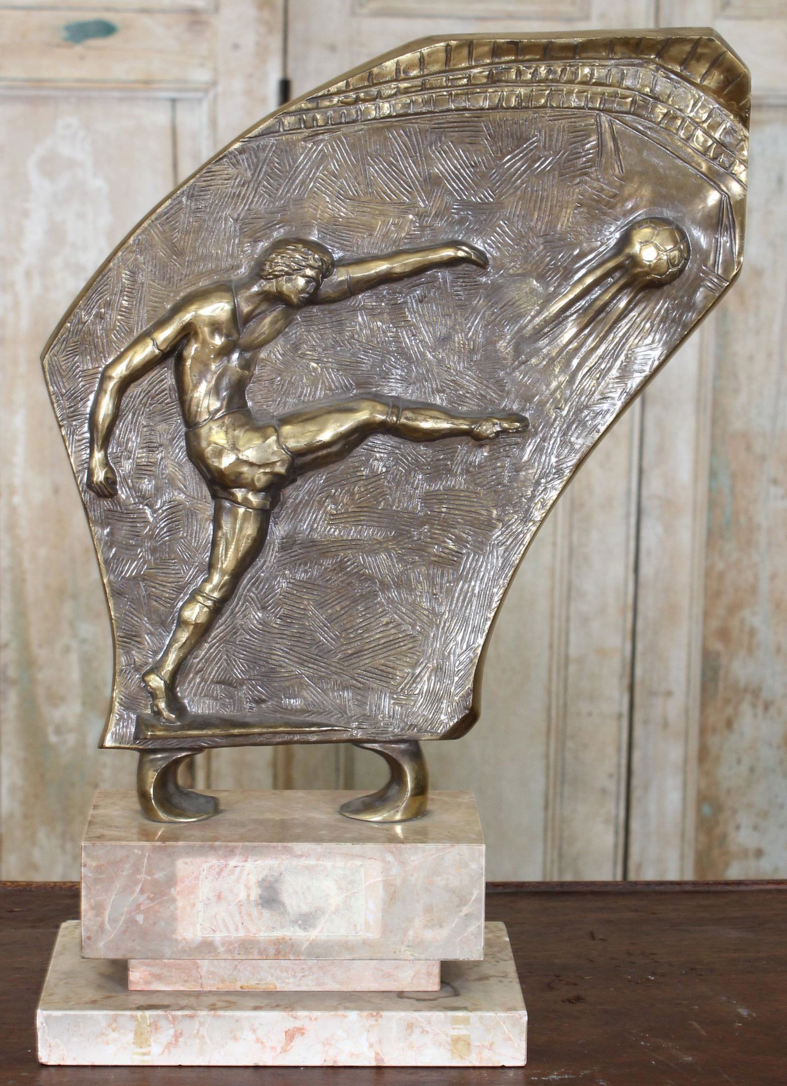 Vintage European Soccer League Trophy: Vintage European Soccer League Trophy. Cast bas relief vignette over marble plinth. Size: 19.75" high.