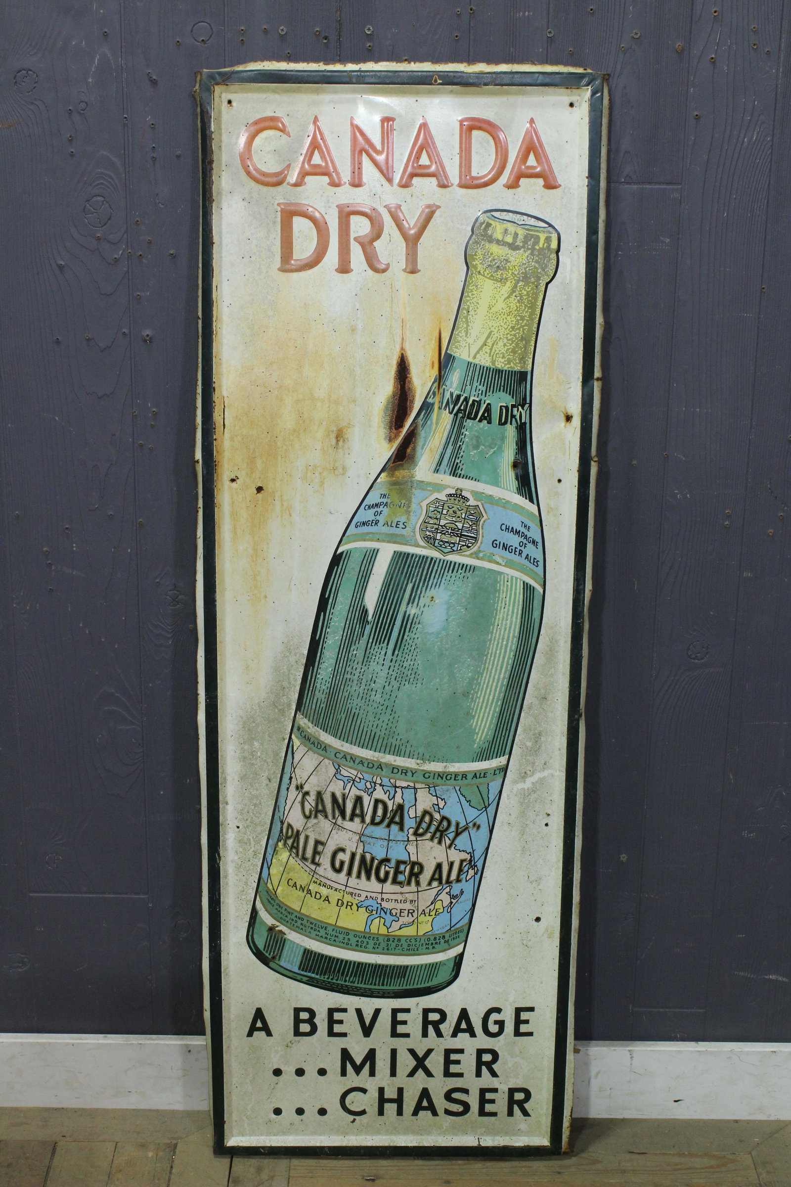 Canada Dry Porcelain over Iron Advertising Sign: Canada Dry Porcelain over Iron Advertising Sign, "Canada Dry, A Beverage ... Mixer ... Chaser". Size: 54" H x 18.75" W.