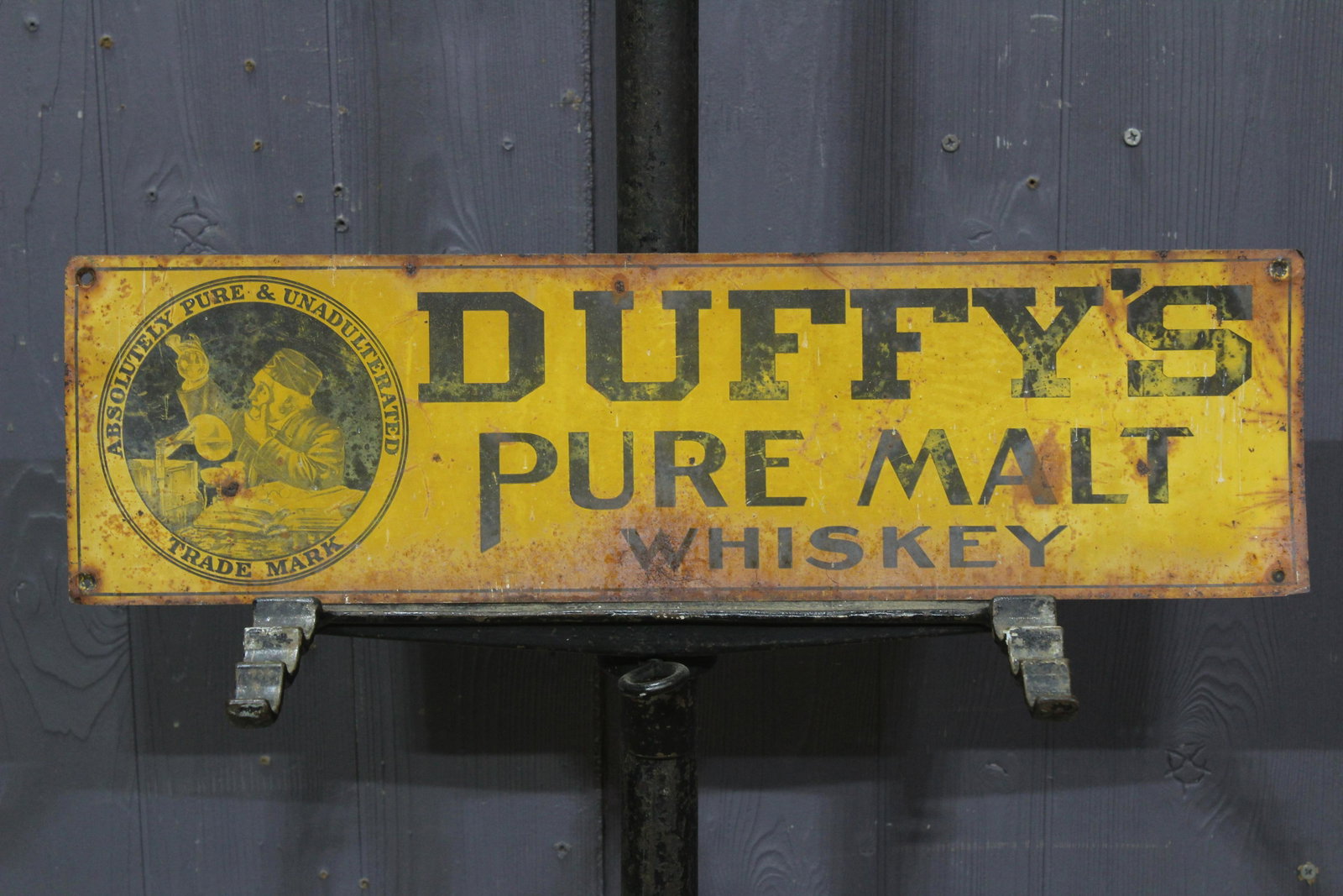 Duffy's Pure Malt Whiskey Tin Advertising Sign: Duffy's Pure Malt Whiskey Tin Advertising Sign, Absolutely Pure & Unadulterated Trade Mark. Size: 5.5" H x 19.5" W.
