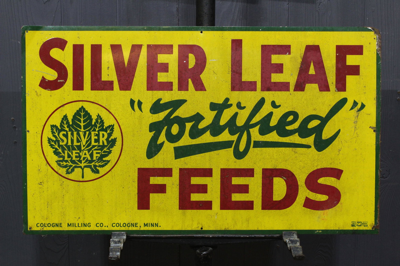 Silver Leaf "Fortified" Feeds Advertising Tin Sign: Silver Leaf "Fortified" Feeds Advertising Tin Sign, Cologne Milling Co., Cologne, Minn. Size: 14" H x 24" W.