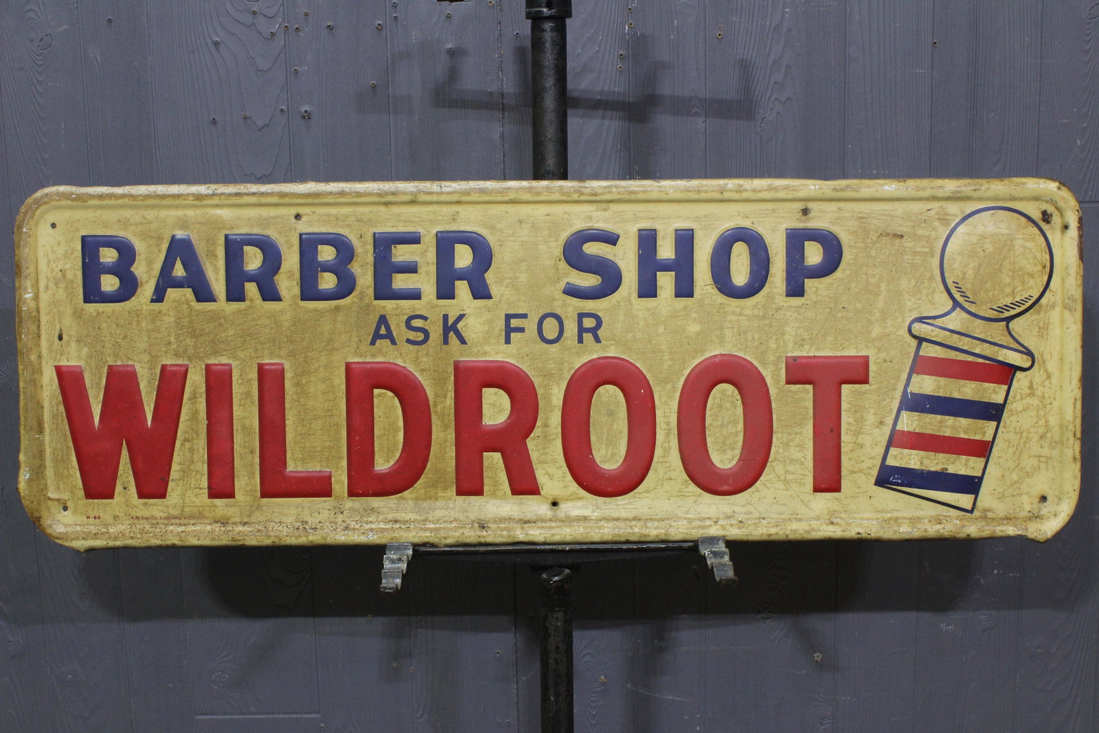 Barber Shop Wildroot Embossed Tin Advertising Sign: Barber Shop Wildroot Embossed Tin Advertising Sign, "Barber Shop Ask for Wildroot", W-65, A-M Sign Co, Lynchburg, Va, 5-56. Size: 13.5" H x 39.5" W.