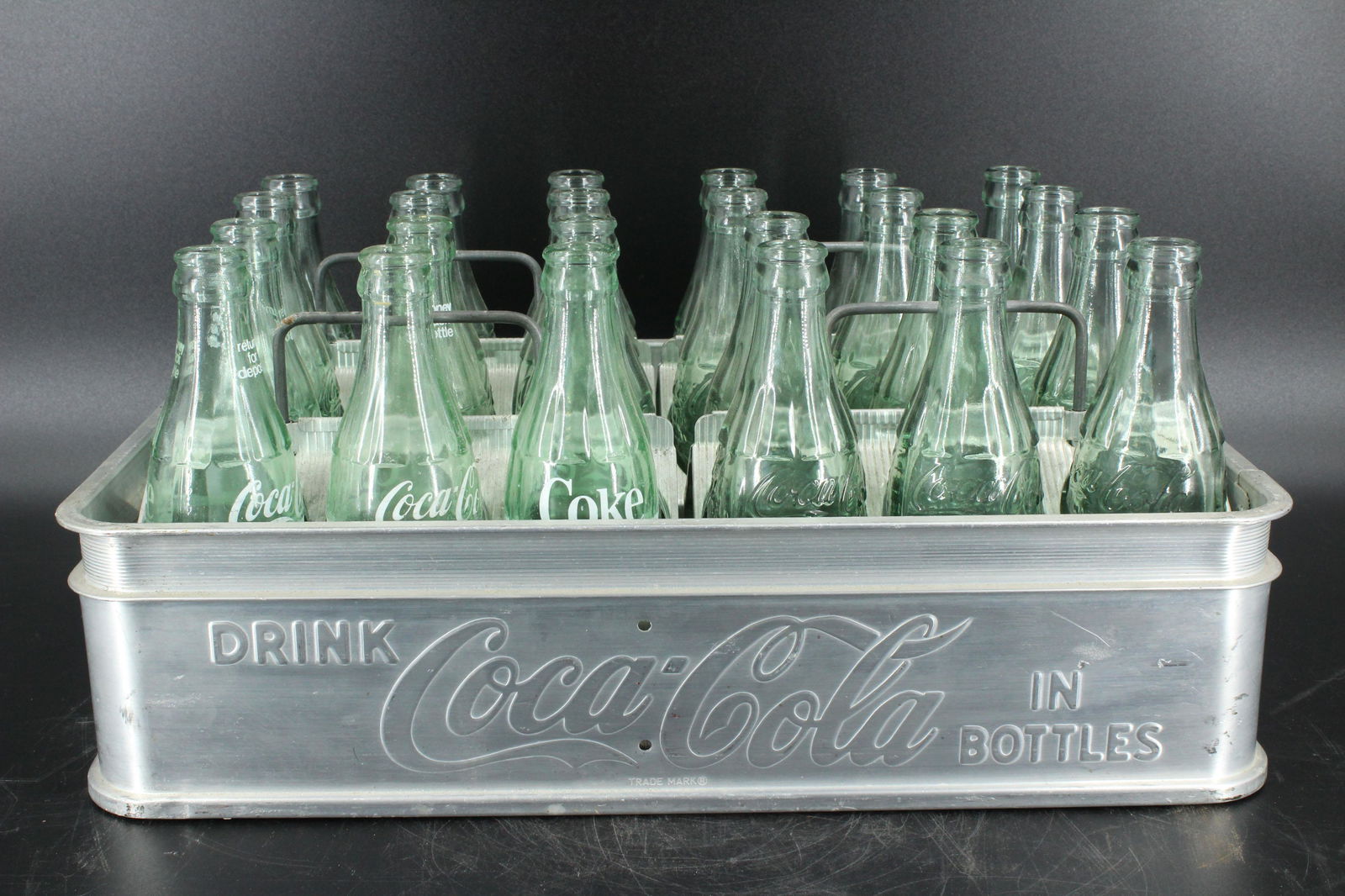 Coca Cola Aluminum Bottle Case: Coca Cola Aluminum Bottle Case with four individual 6-bottle carry cases. Carrying case is embossed Drink Coca-Cola in Bottles, marked Property of The Coca-Cola Bottling Company, the individual carrie