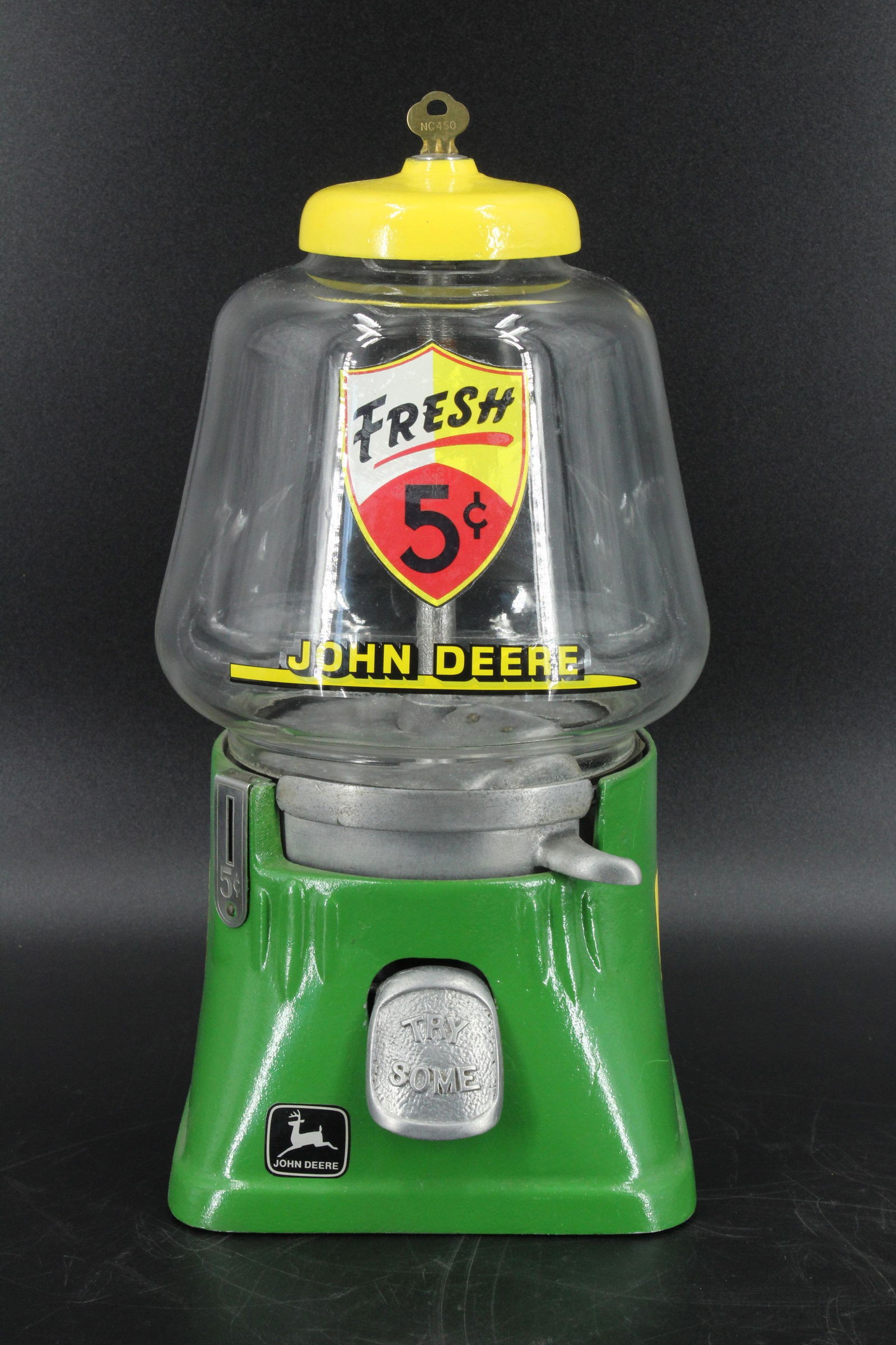 John Deere 5 Cent Gum Ball Machine: John Deere 5 Cent Gum Ball Machine, Fresh 5 Cent, John Deere painted decals, with key. Size: 13" D x 7" W x 7" D