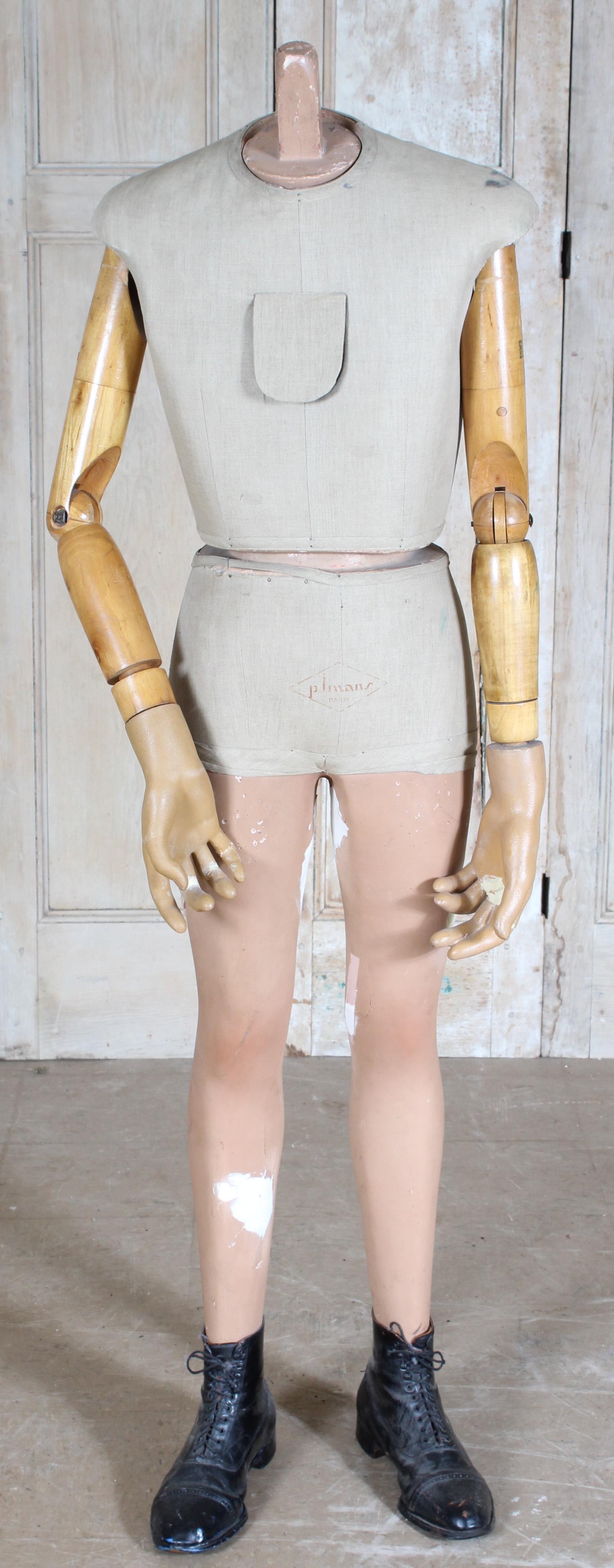 French Composition and Wood Mannequin: French Composition and Wood Mannequin, cloth covered torso, with makers stamped mark on front P. Imans Paris. Size: 64" H x 20.5" W x 13" D