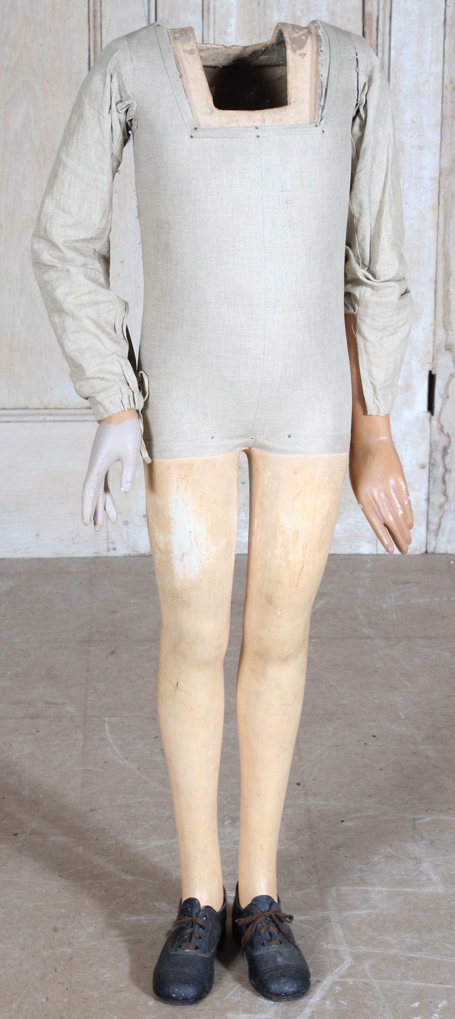 Composition and Wood Mannequin: Composition and Wood Mannequin, cloth covered torso. Size: 44" H x 16" W x 8" D