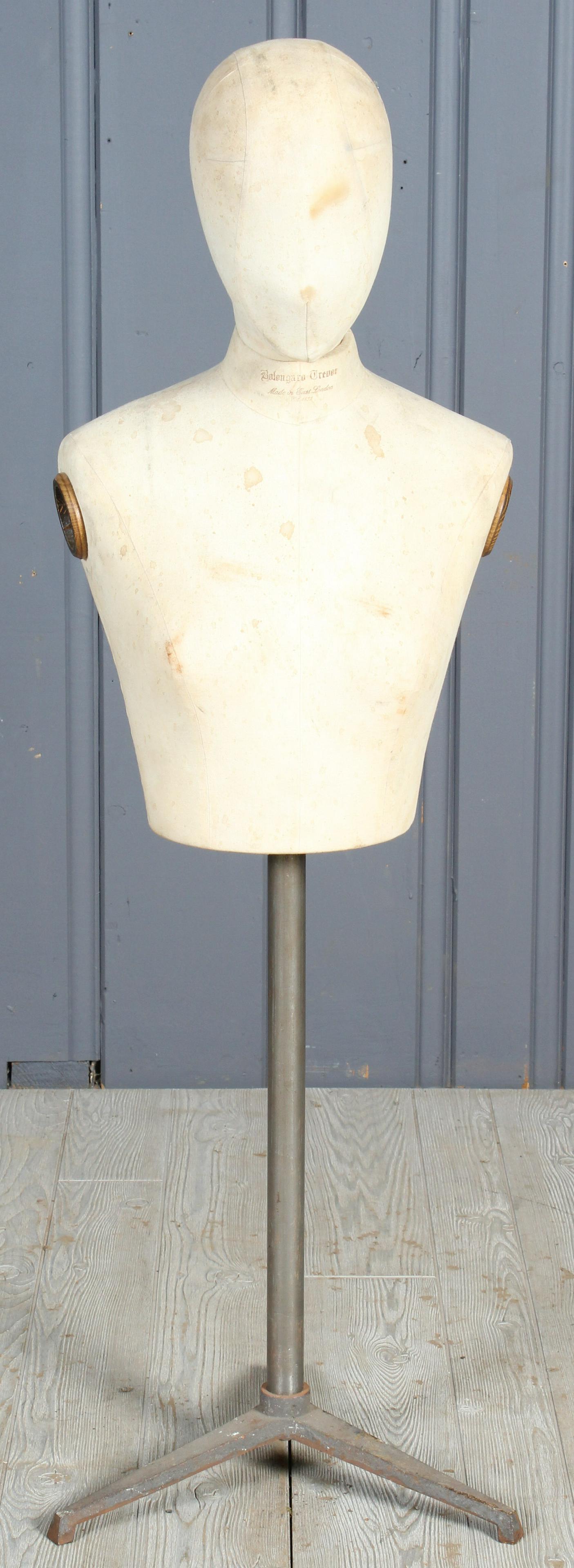 English Mannequin: English Dress Form, mannequin on stand with head form, stamped at neck "Bolongaro Trevor, Made in East London, Est. 1832". Size: 48" H x 16" W x 14.5" D