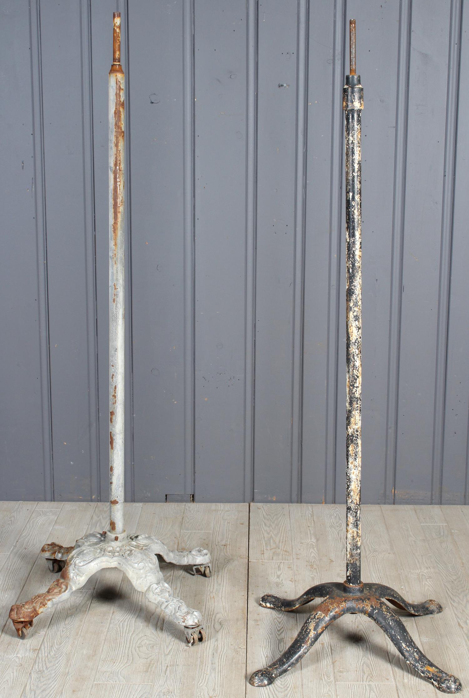 2 Haberdashery Display Posts: A lot of two antique cast iron clothing rack bases one with ornate base. 70" x 30" x 30"