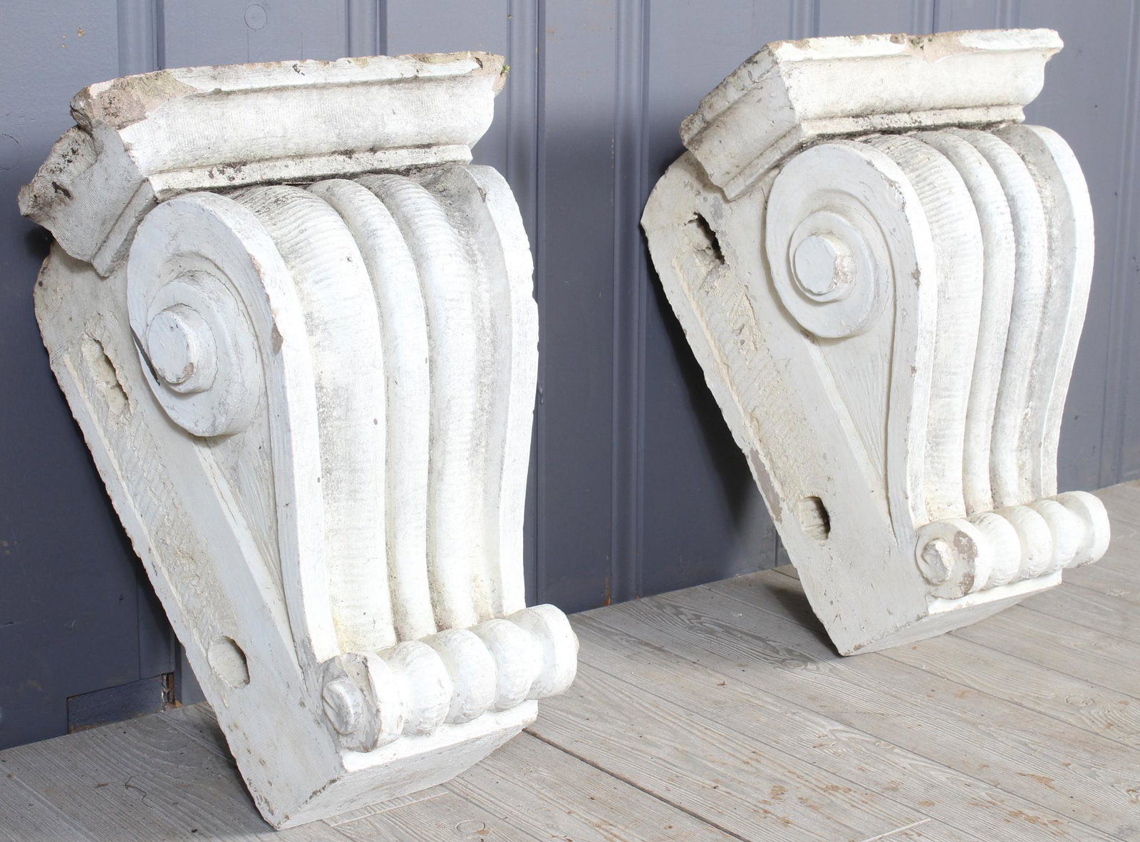 Pair Architectural Terracotta Volute Corbels: A pair of turn of the century terracotta architectural corbels with scroll decoration. Size: 20"H x15"W x 13"D