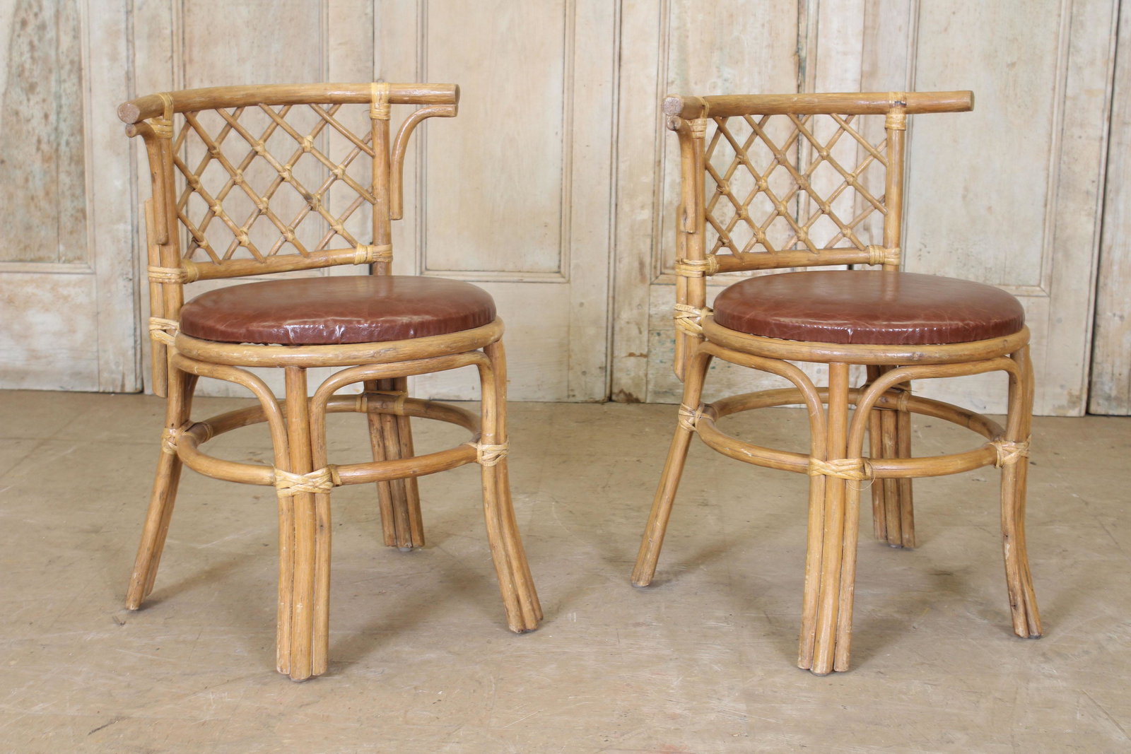 Pair Rattan Klismos Form Chairs: Pair Rattan Klismos Form Chairs. Size: 27.5" x 20.5" x 18"