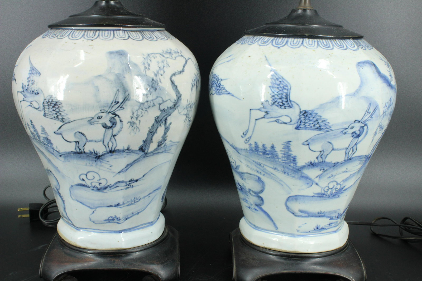 Pair of Antique Korean Jars as Lamps: Pair of Korean Lamps, blue and white ceramic lamps, depicting animals, crane, deer and turtle with bamboo. 16"H x 8"W x 8"D