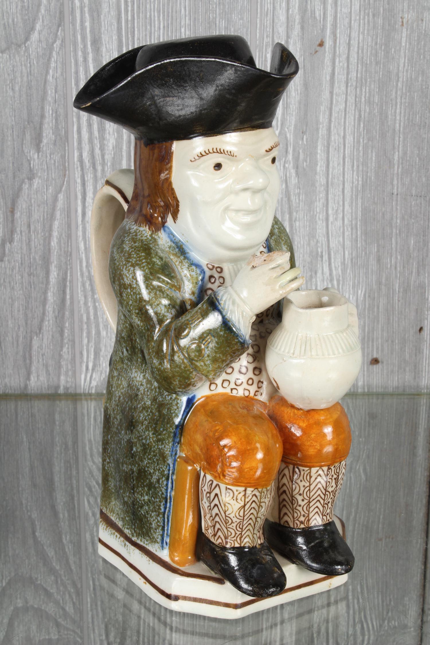 Ralph Wood Type Toby Jug: Ralph Wood Type Toby Jug, seated holding a jug on knee, with lid. Size 10 1/4" x 4 1/4" x 6 3/4".