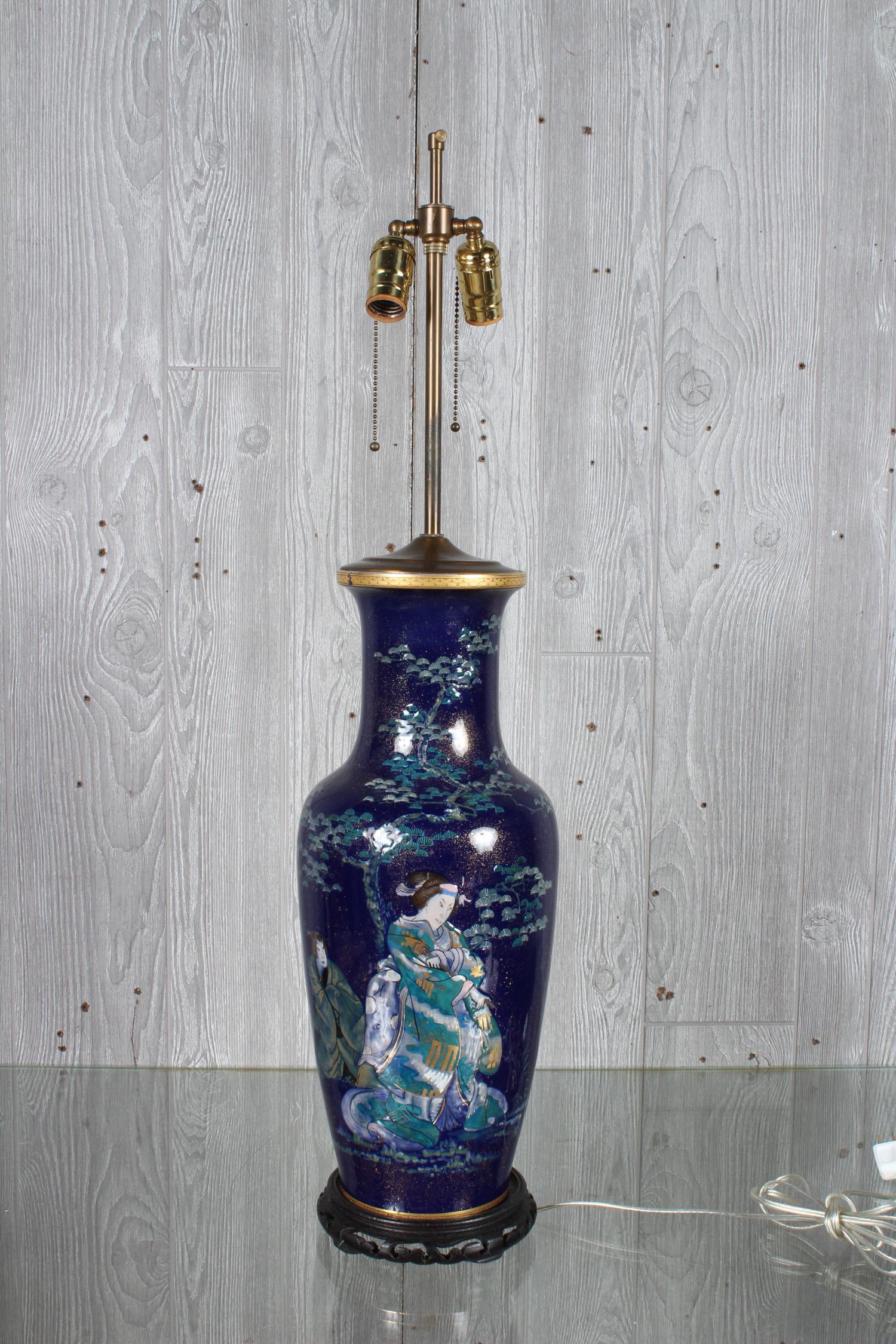 Japanese Geisha Motif Porcelain Lamp: Japanese Geisha Motif Porcelain Lamp, figural design. Size: 34" H x 8" W x 8" D; Shade: 17" Diam.