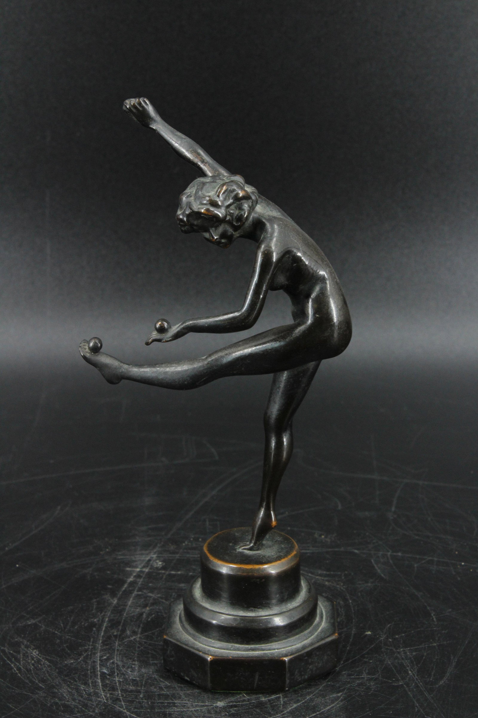 Figural Dancer After Colinet: Figural Dancer After Colinet, Art Deco Nude Juggler on plinth base, unsigned. Size: 9" H x 4" W x 3" D.