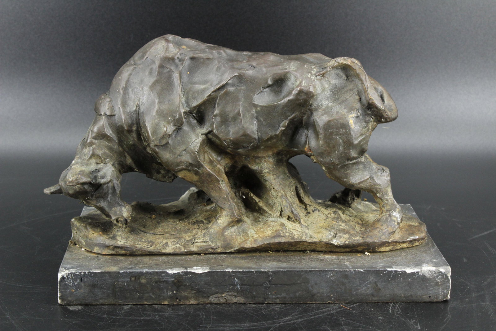 Bronze Cow Sculpture: Bronze Cow Sculpture, unsigned, mounted on slate base. Size: 8" H x 13" W x 7.25" D.
