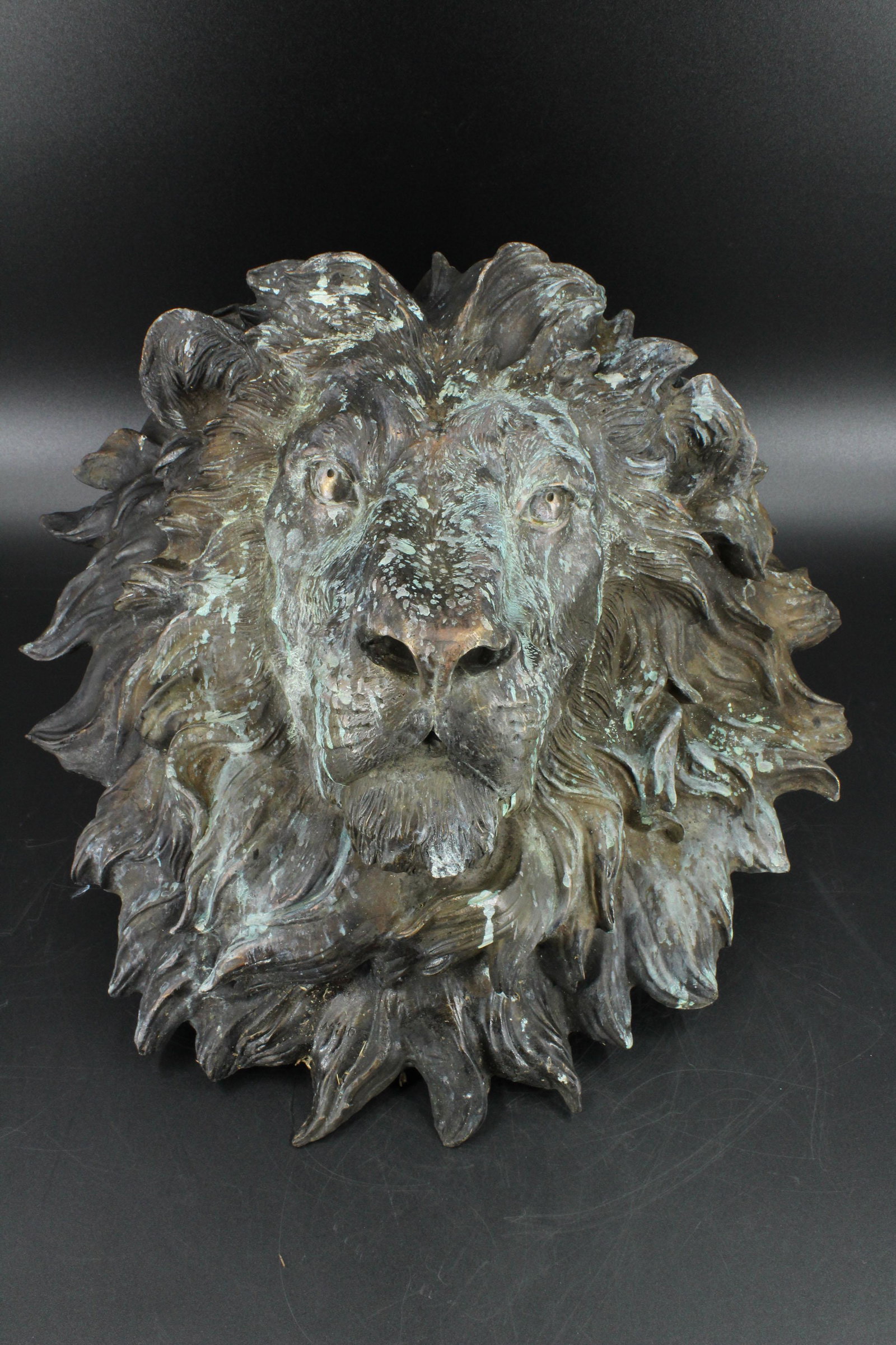 Bronze Lion Head Bust Sculpture Wall Mount: Bronze Lion Head Bust Sculpture Wall Mount, signed Milo (after) in mane. Size: 17" H x 17" W x 8" D.