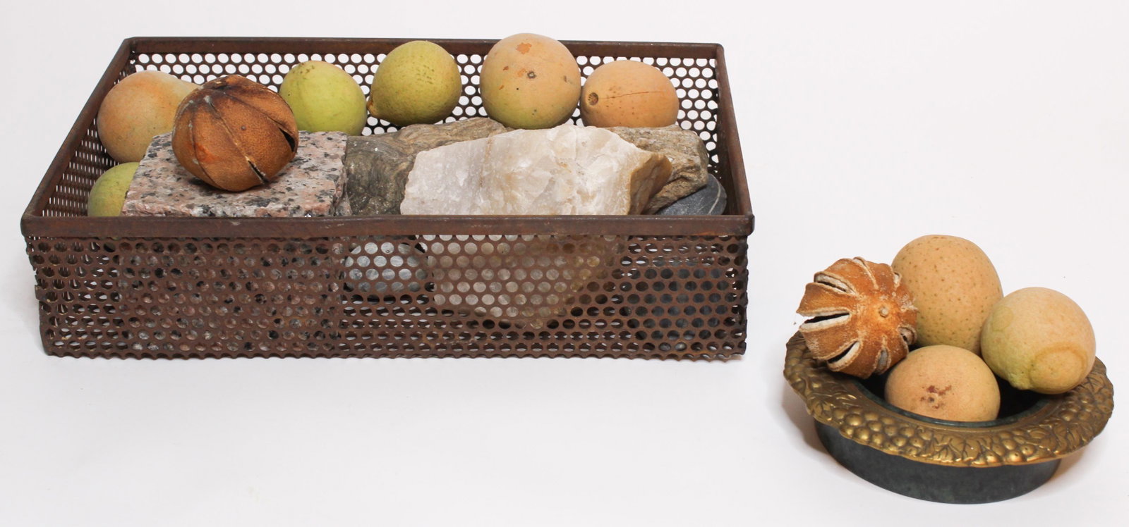 Grouping of Painted Carved Fruit and Rock Specimen: Grouping of Painted Carved Fruit and Rock Specimen, two dried orange peels, brass and stone bowl with repousse rim, and some stone specimens. Size: Largest: 3" H x 14" W x 10" D; Specimen: 2" H x 11.5