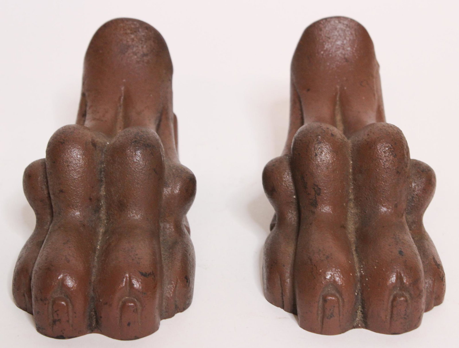Pair of Painted Cast Iron Paw Feet: Pair of Painted Cast Iron Paw Feet, unmarked. Size: 4" H x 4" W x 7" D ***Please Note: This is an on-site online auction with specific Pick up terms and conditions. Pick up day is scheduled for 8/29 i
