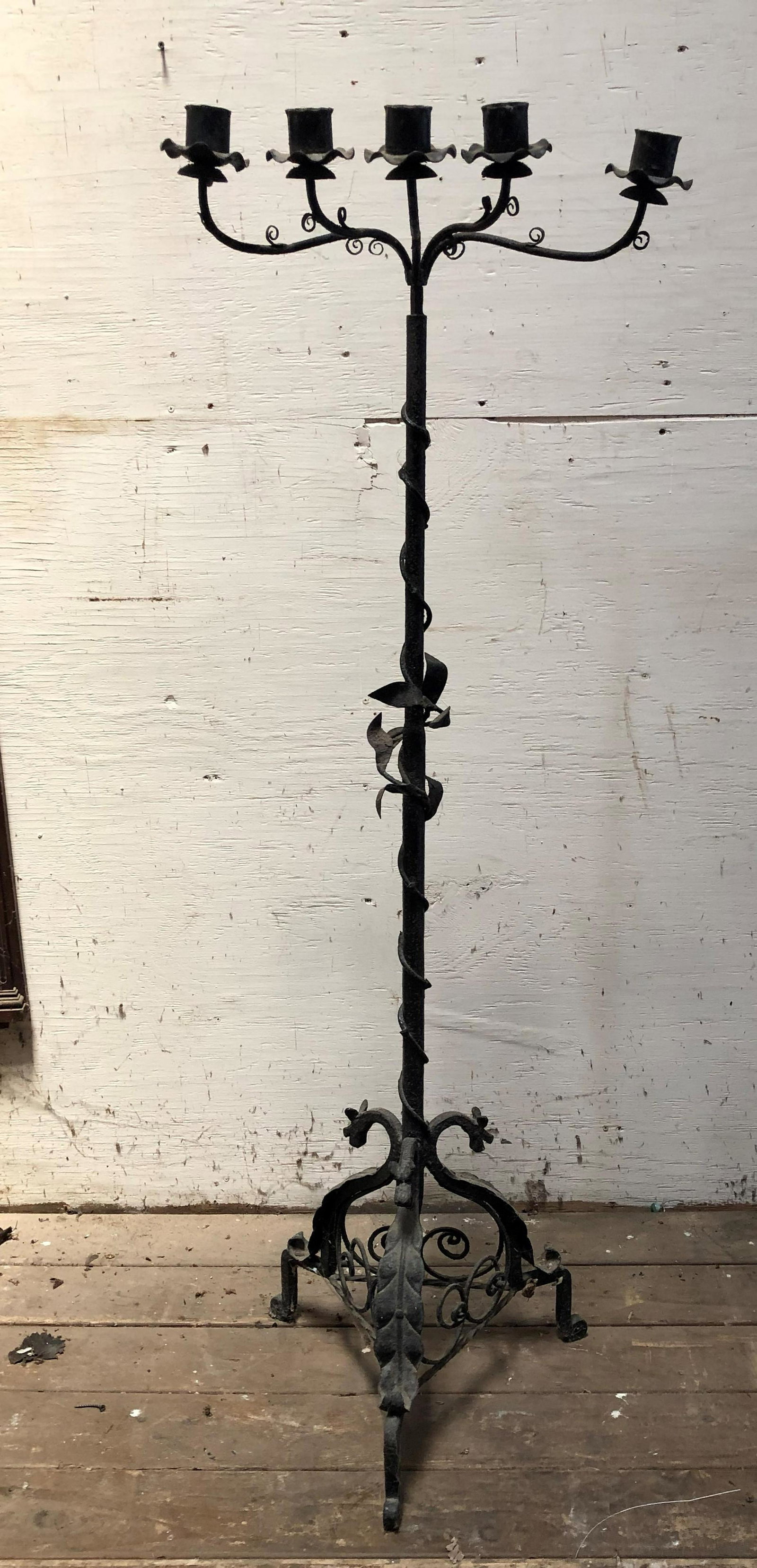Interesting Early 20th C. Yellin Style Candelabra: Interesting Early 20th C. Yellin Style Candelabra, hand wrought iron candelabra having vine, leaf, and dragon decoration. 56" H x 19.5" Diameter. ***Please Note: This is an on-site online auction with