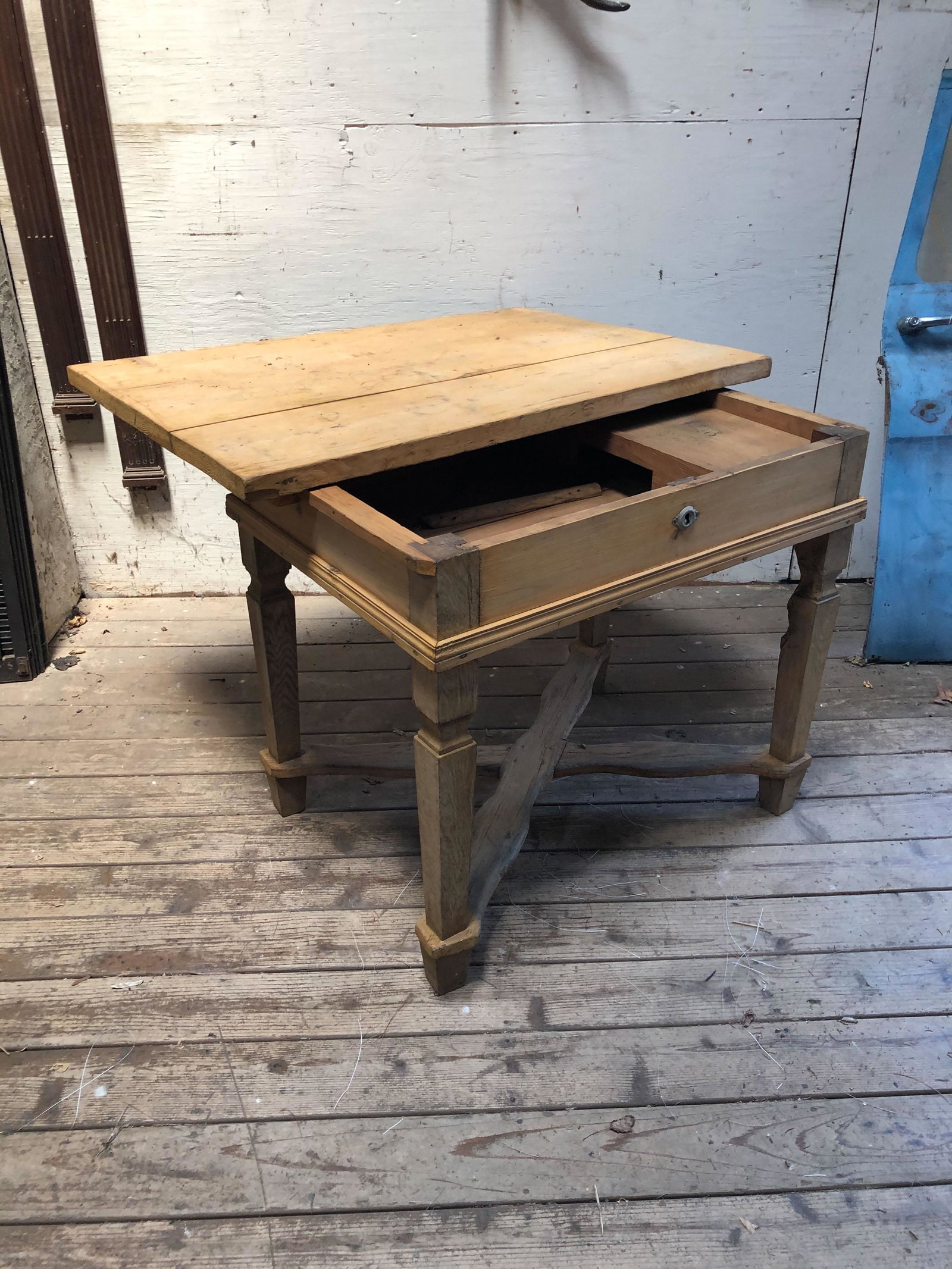 Late 19th C. Continental Stripped Pine Work Table: Late 19th C. Continental Stripped Pine Work Table having sliding top over interior compartments above x-form stretcher. Size: 32.5" H x 43" W x 30.5" D. ***Please Note: This is an on-site online aucti