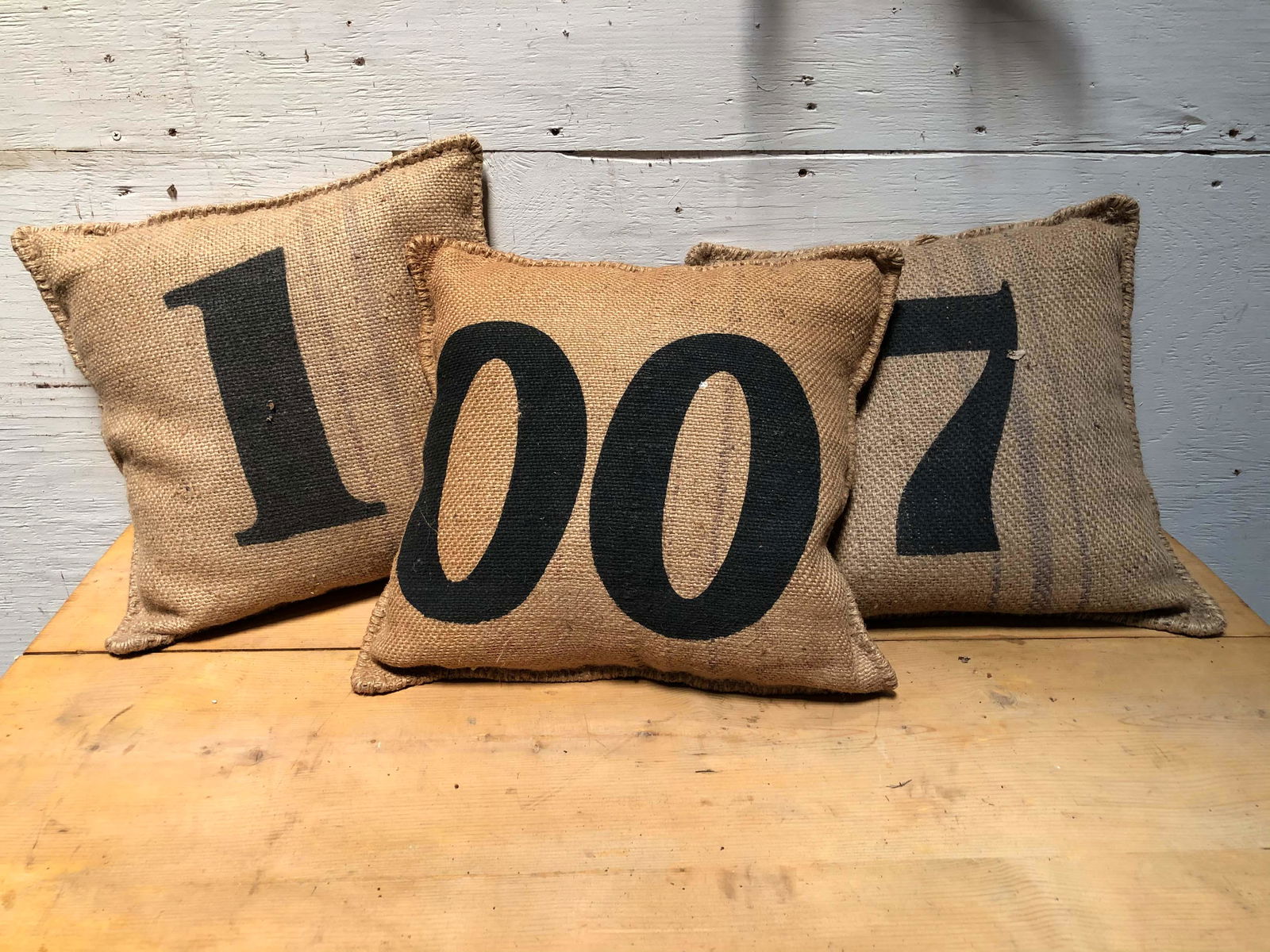 Lot of 3 Decorator Burlap Pillows: Lot of 3 Decorator Burlap Pillows with printed numbers. Size: 17" H x 17" W. ***Please Note: This is an on-site online auction with specific Pick up terms and conditions. Pick up day is scheduled for