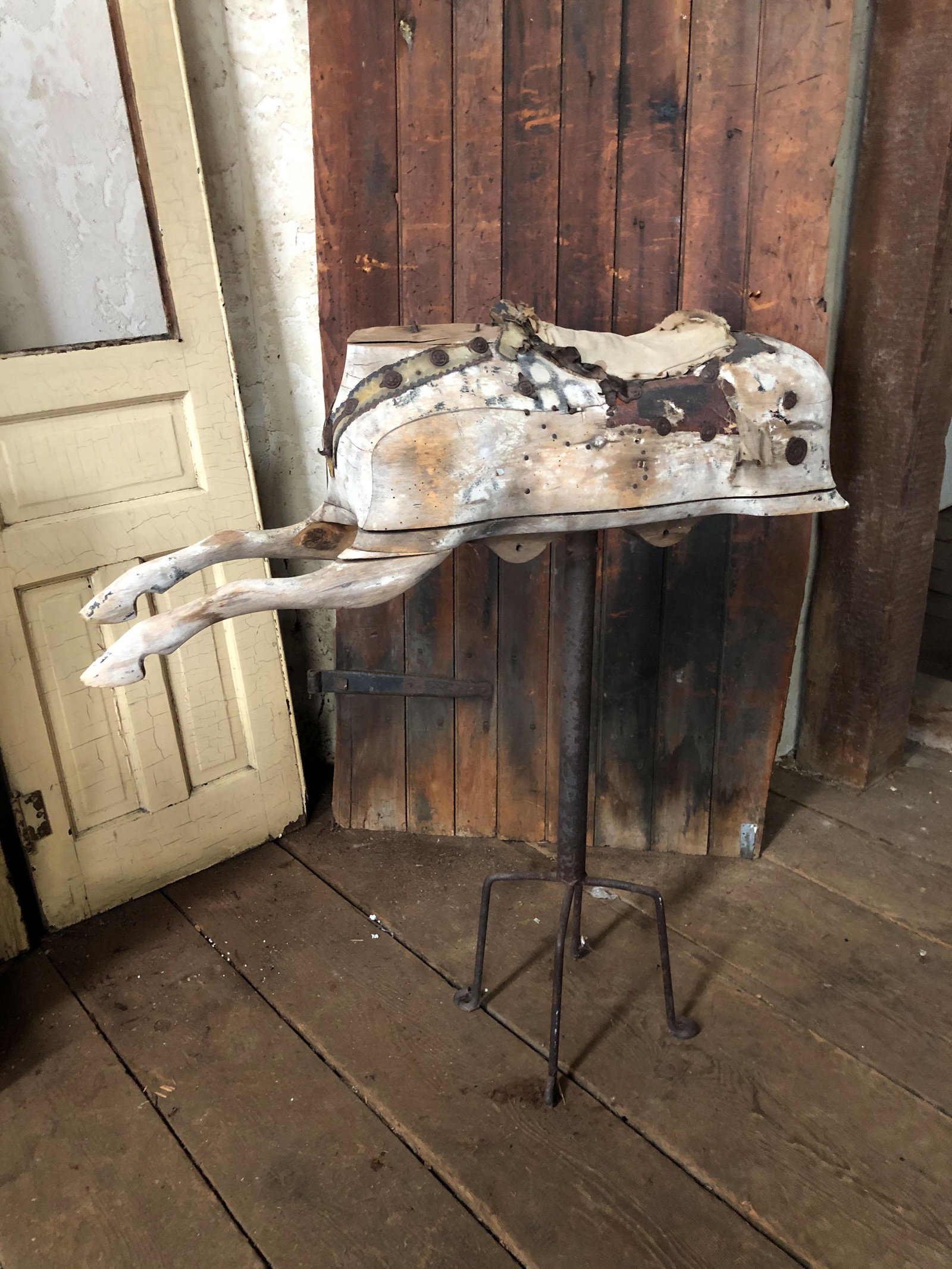 Antique Carved Wood Carousel Horse Fragment: Antique Carved Wood Horse Fragment with remnants of saddle and dapple paint decoration mounted on metal stand. Size: 44" H x 38" W x 8" D. Horse: 12" H ***Please Note: This is an on-site online auctio