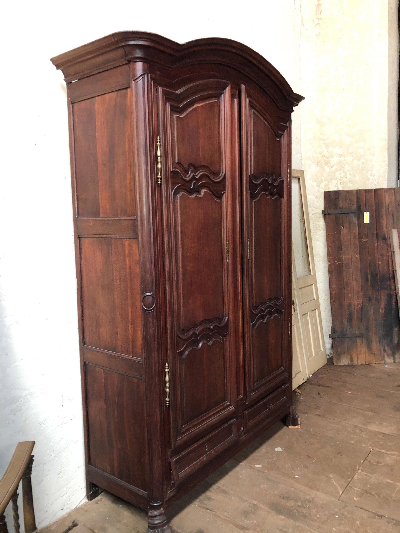 Late 18th Early 19th C. French Carved Armoire: Late 18th Early 19th C. French Carved Armoire having shaped cornice over 2 raised panel doors and 2 drawers. Size: 107" H x 68" W x 24" D. ***Please Note: This is an on-site online auction with specif
