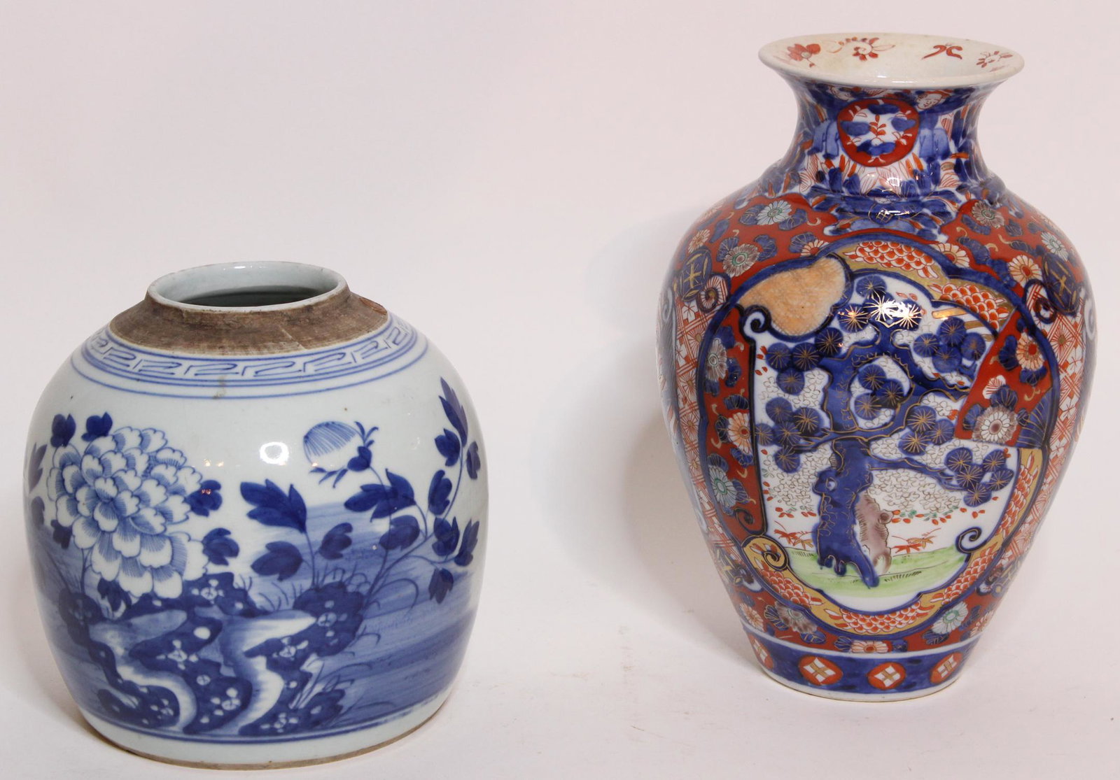 Two Chinese Porcelain Vases: Two Chinese Porcelain Vases, one blue and white vase with floral and foliate design, taller vase with tree and foliate design. Size: Largest: 10" H x 6.5" W x 6.5" D ***Please Note: This is an on-site