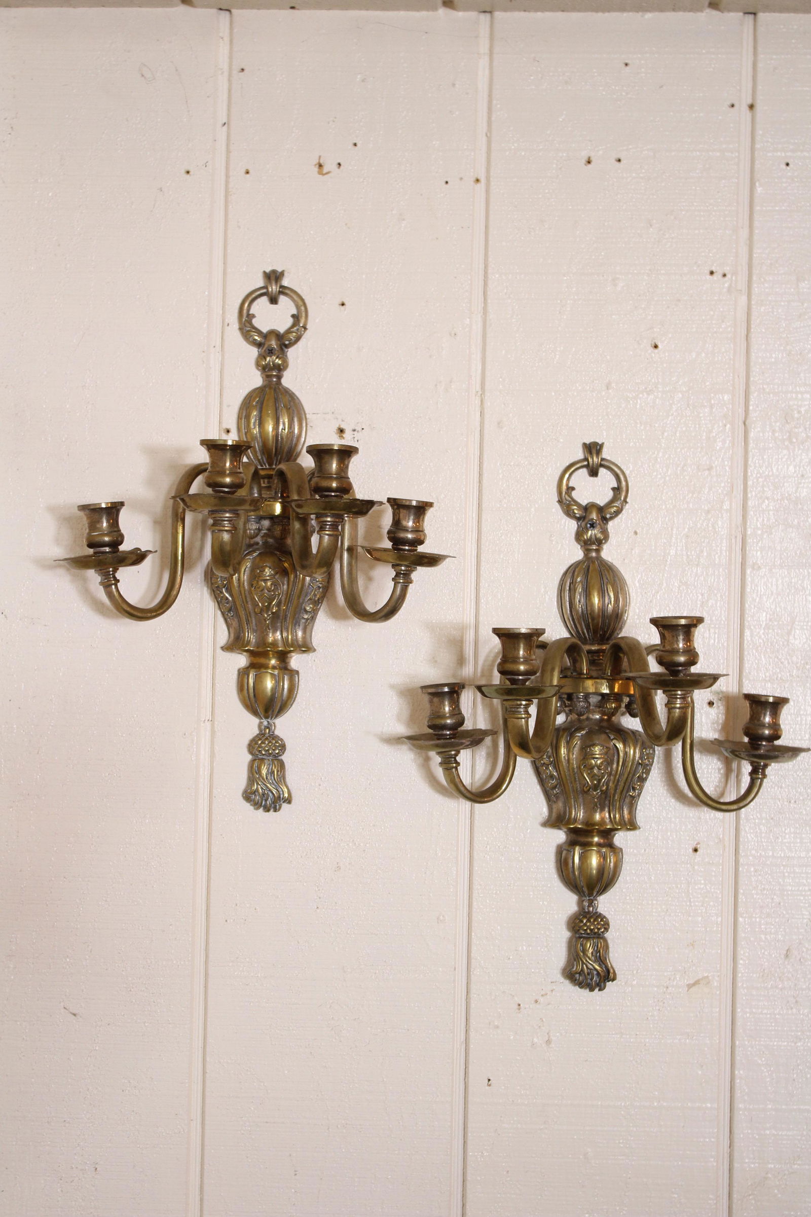 Pair of Brass Candelabra Wall Sconces: Pair of brass wall sconces, quadruple arms. Size: 17"H x 12.5"W x 7.5"D ***Please Note: This is an on-site online auction with specific Pick up terms and conditions. Pick up day is scheduled for 8/29