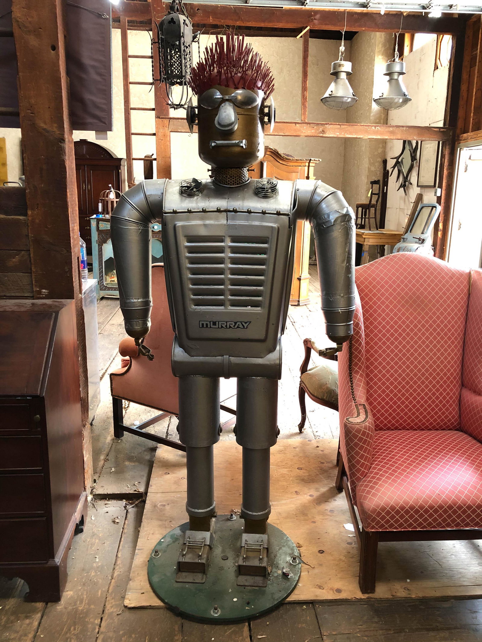 "Murray" -Metal Morphosis Sculpture: "Murray" -Metal morphosis sculpture by Kris Nethercutt dated 3-19-08. Very interesting found object robot form. Size: 79"H x 36"W x 24"D ***Please Note: This is an on-site online auction with specific