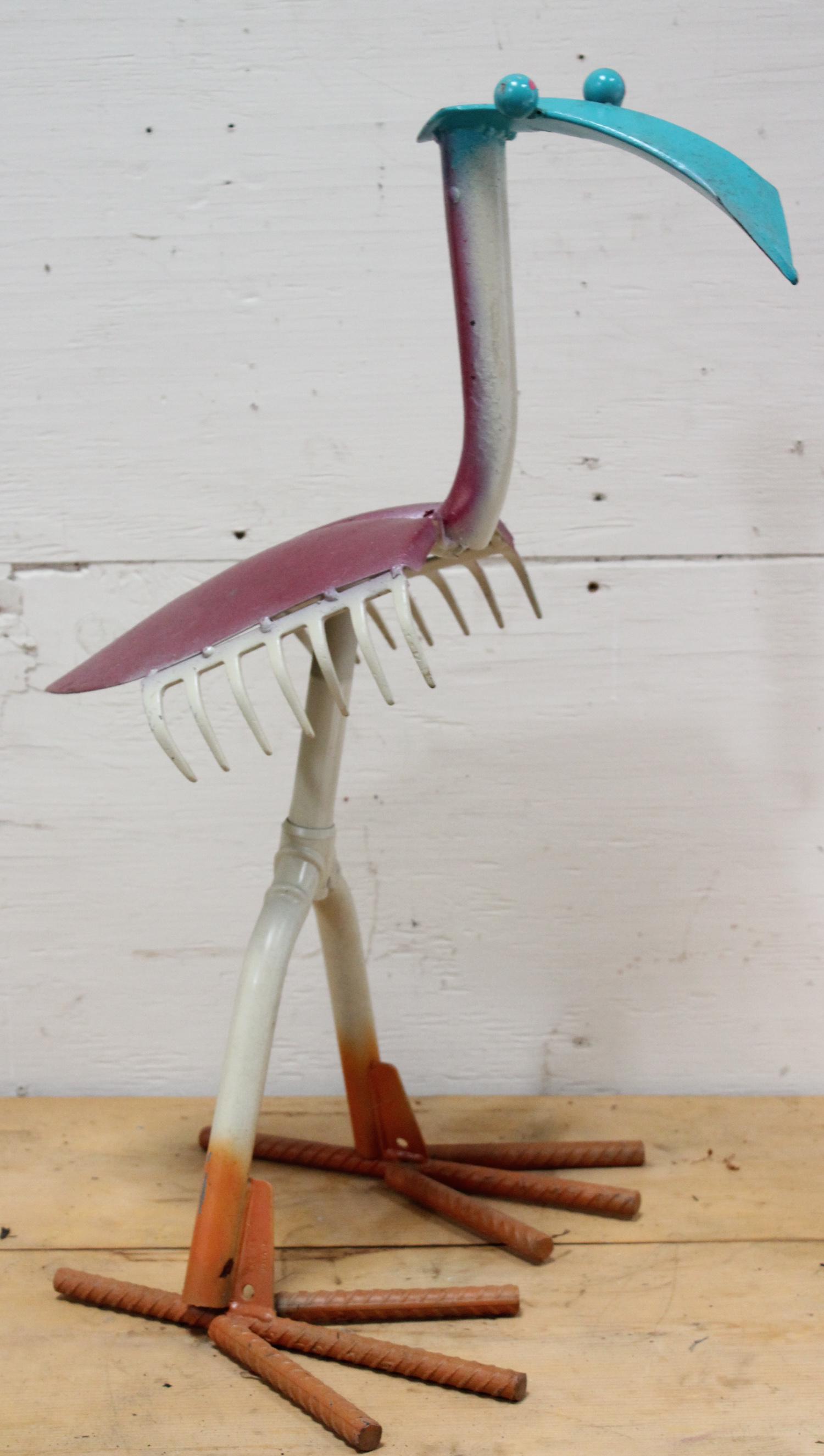 Whimsical Found Object Garden Sculpture: Found object colorful garden sculpture. Size: 27.5"H x 13"W x 16"D ***Please Note: This is an on-site online auction with specific Pick up terms and conditions. Pick up day is scheduled for 8/29 in Fr