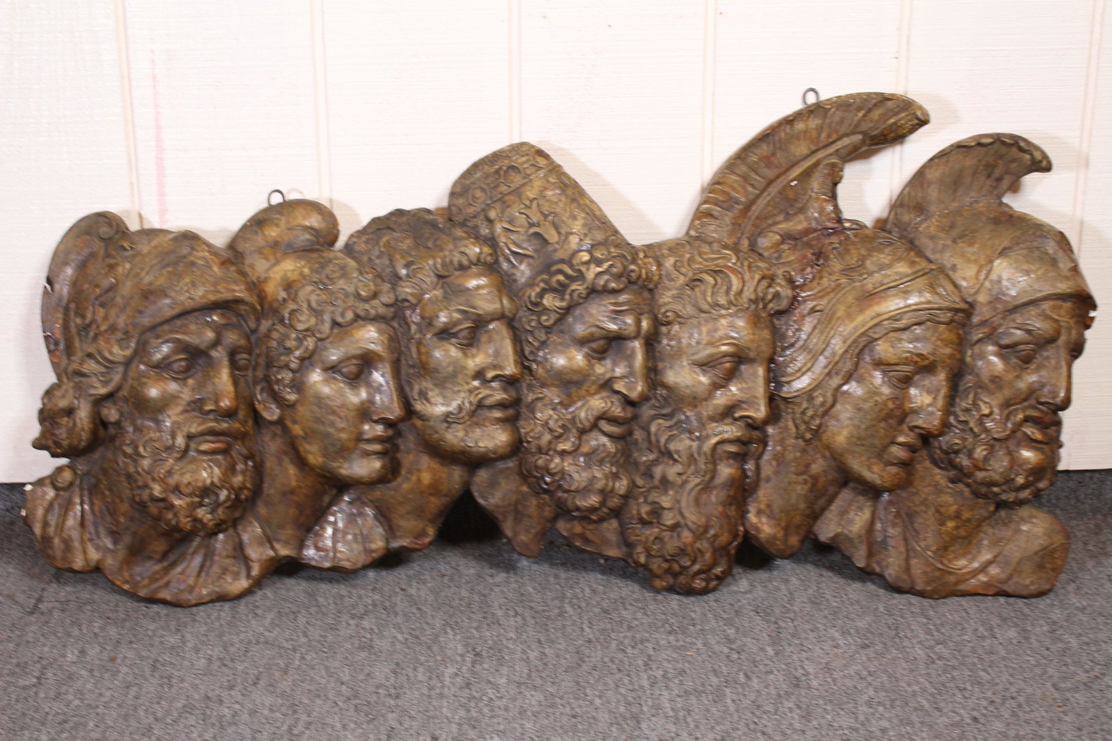 Plaster Relief Wall Plaque of Roman Soldiers: Plaster relief wall plaque of Roman soldiers. Unmarked. Size: 20.5"H x 43"W x 2.5"D ***Please Note: This is an on-site online auction with specific Pick up terms and conditions. Pick up day is schedul