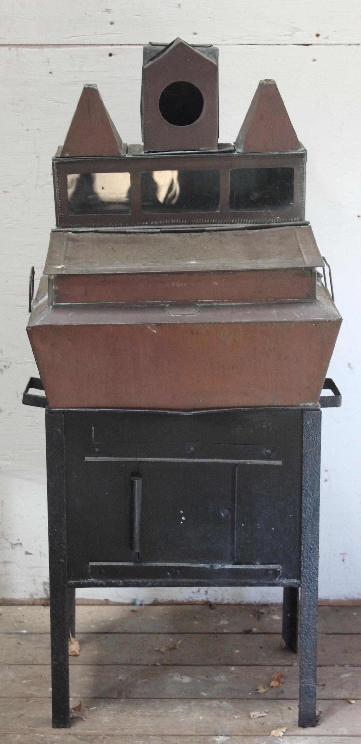 Labeled Silver Brothers Copper Specialty Cabinet: Interesting turn of the century labeled Silver Brothers, copper cabinet resting on an iron base with sliding door. Intended use is unknown. Size: 48"H x 21"W x 14.5"D ***Please Note: This is an on-sit