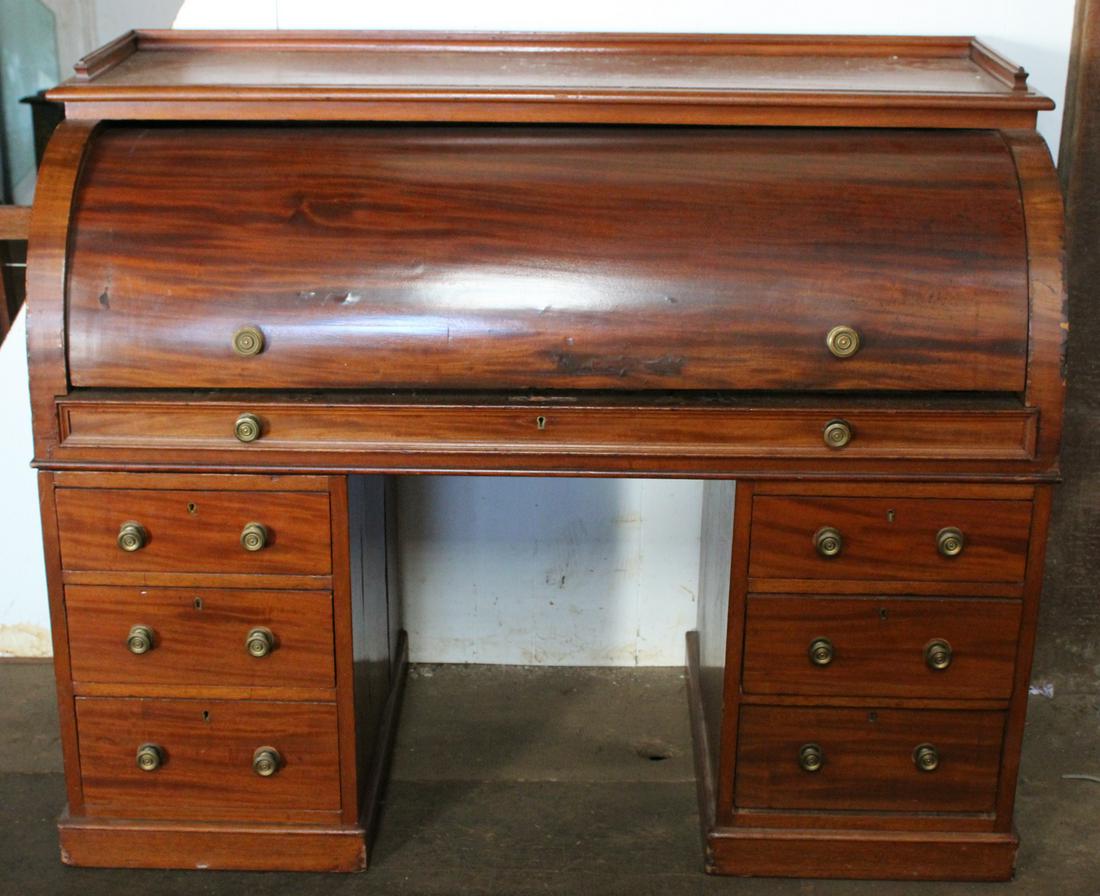 19th Century English Cylinder Desk.: 19th Century English cylinder desk having burled walnut interior drawers over slide out desk and a set of two drawers. Size: 43"H x 53.5"W x 24"D ***Please Note: This is an on-site online auction with