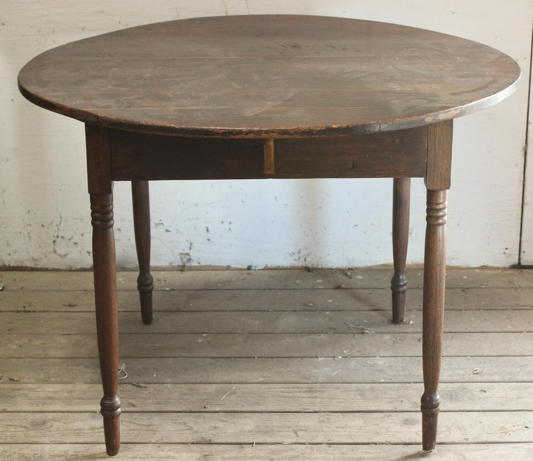 Late 19th C. Country Table: A late 19th century country table having a round top supported on turned legs. Size: 30"H x 42" Dia. ***Please Note: This is an on-site online auction with specific Pick up terms and conditions. Pick 