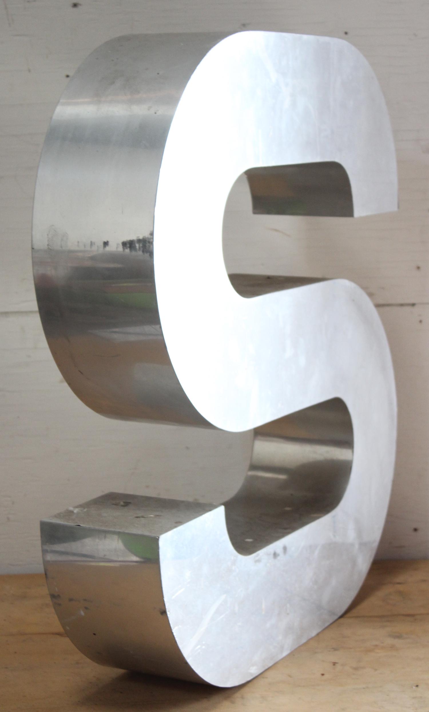 Large Graphic Metal Letter "S": Large graphic metal letter "S" Size: 30"H x 37"W x 6"D ***Please Note: This is an on-site online auction with specific Pick up terms and conditions. Pick up day is scheduled for 8/29 in Frazer, PA. Th