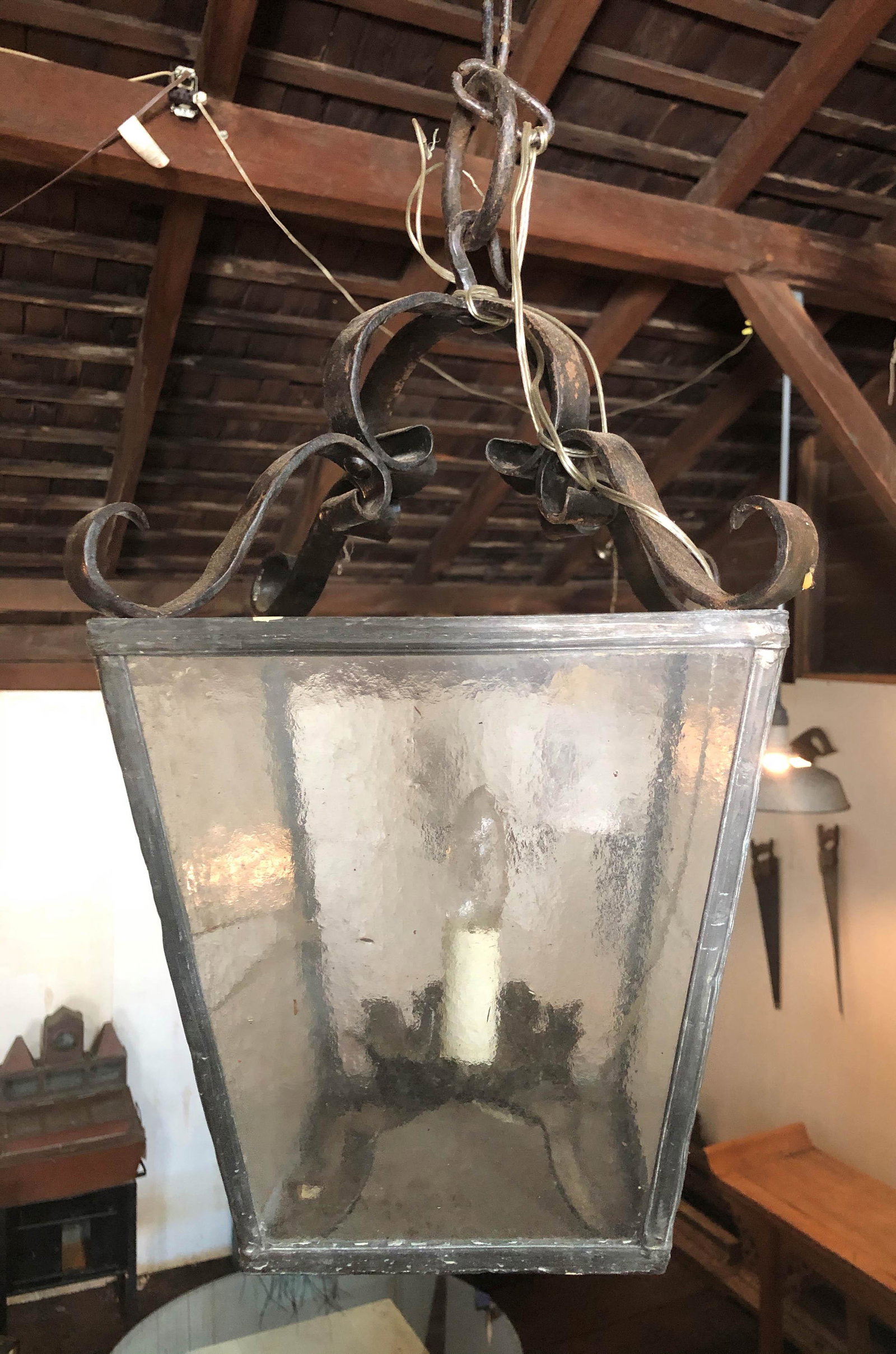 Wrought Iron and Leaded Glass Pendant Lantern: Wrought Iron and Leaded Glass Pendant Lantern. Size: 16" H x 10" at widest ***Please Note: This is an on-site online auction with specific Pick up terms and conditions. Pick up day is scheduled for 8/