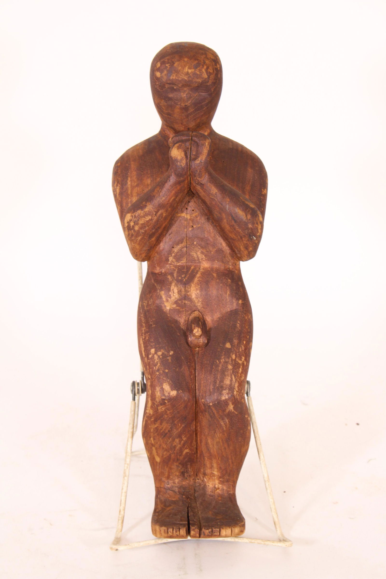 Early Wood Carved Figure: Early Wood Carved Figure. Size: 15" H x 5" W x 4.5" D. ***Please Note: This is an on-site online auction with specific Pick up terms and conditions. Pick up day is scheduled for 8/29 in Frazer, PA. Th