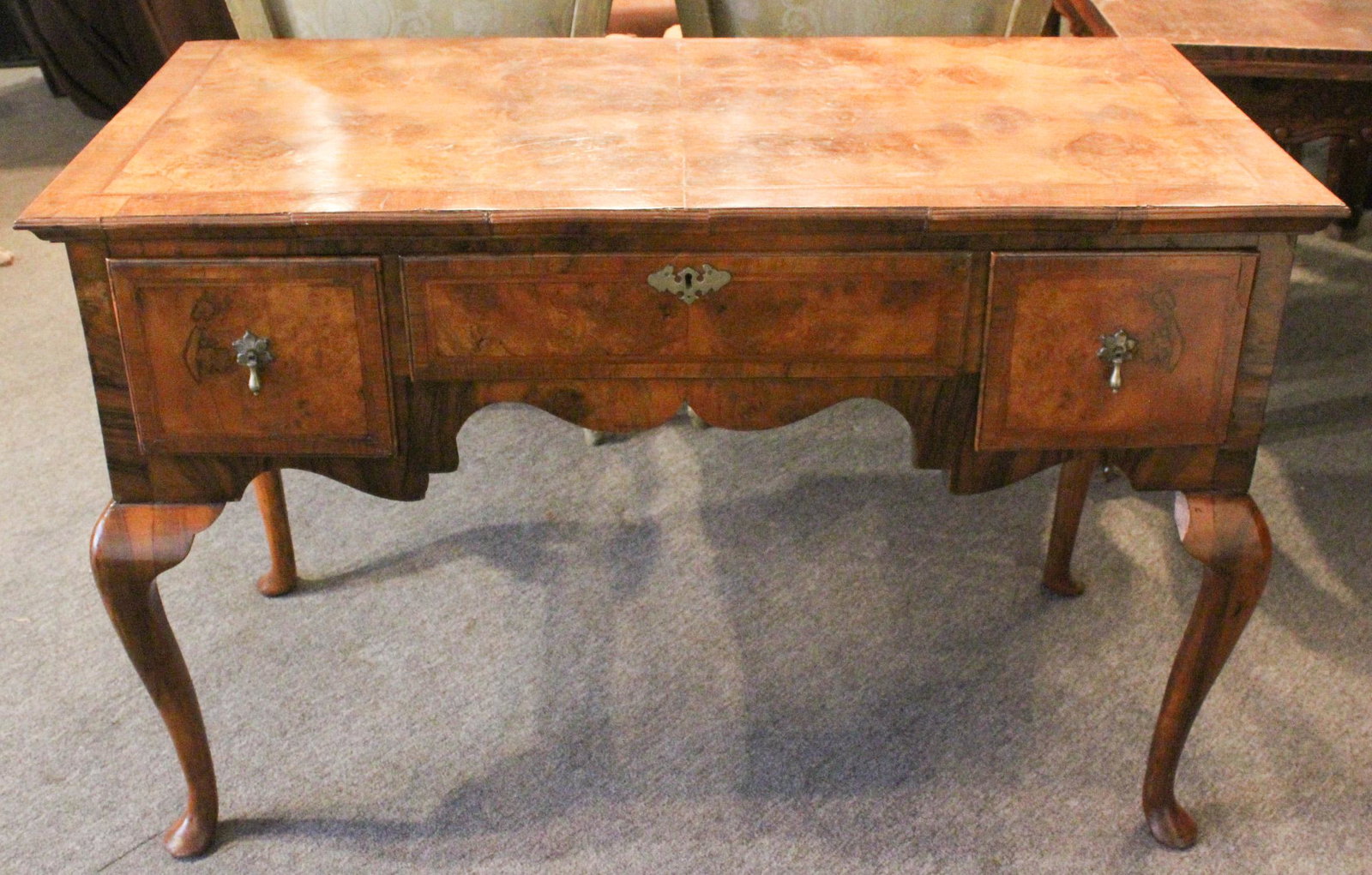 19th C English Queen Anne Style Burled Walnut Desk: 19th C English Queen Anne Style Burled Walnut Desk. Size: 32" x 48" x 22" ***Please Note: This is an on-site online auction with specific Pick up terms and conditions. Pick up day is scheduled for 8/2