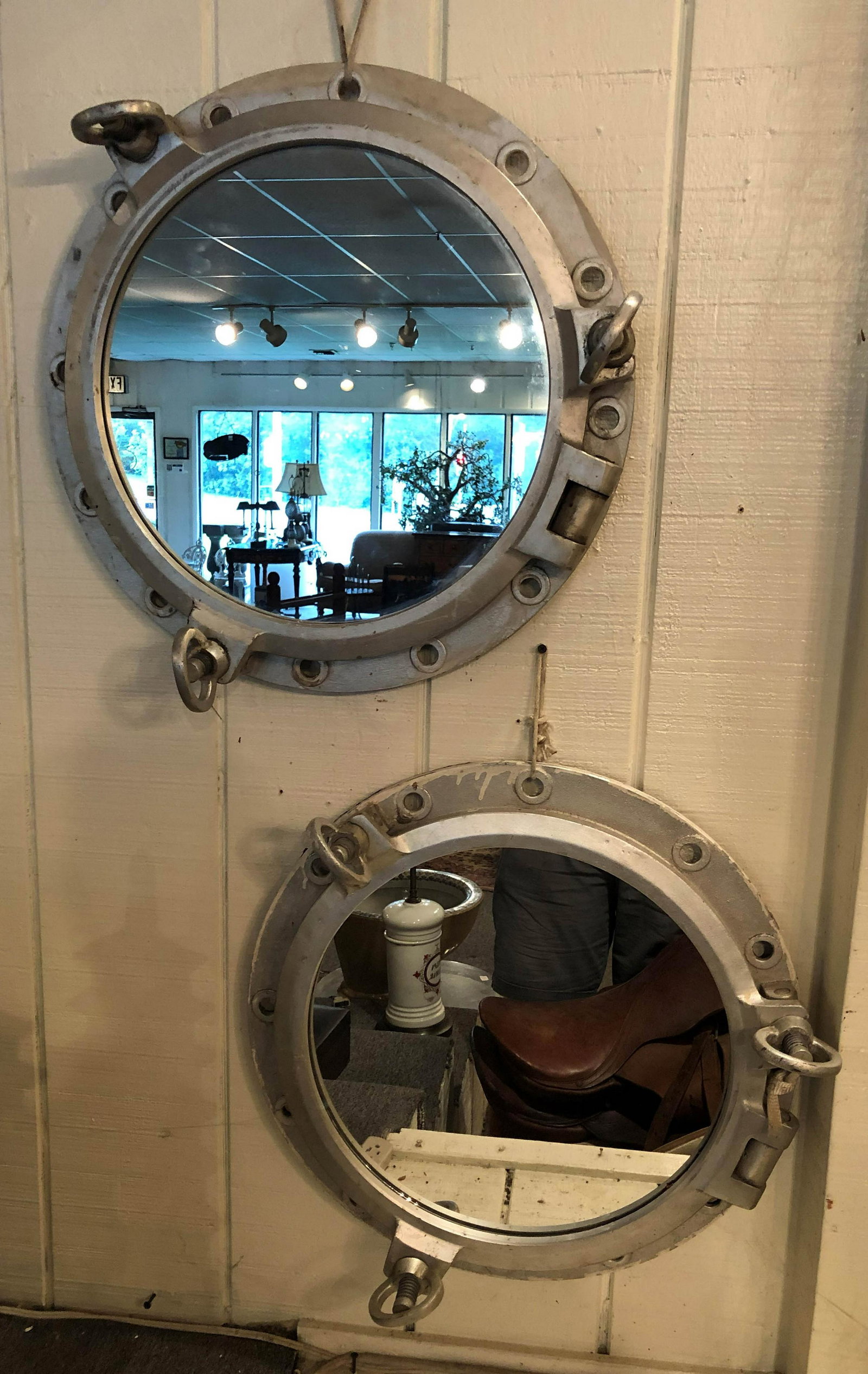 Pair Nautical Porthole Mirrors: Pair Nautical Porthole Mirrors. Fashioned from salvaged ship parts. Size: 21" diameter x 5" deep ***Please Note: This is an on-site online auction with specific Pick up terms and conditions. Pick up d
