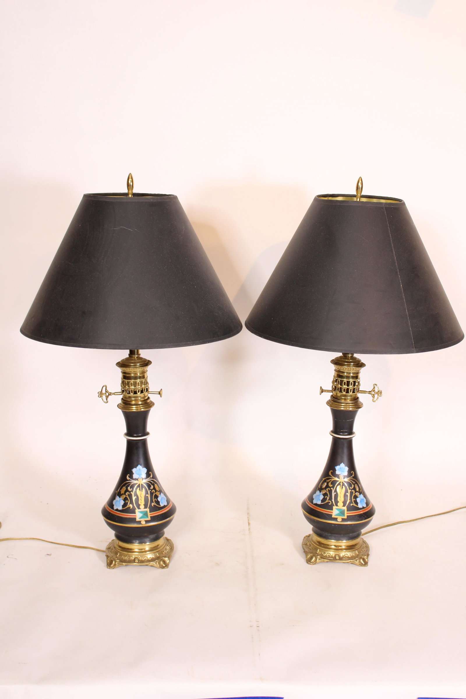Pair Aesthetic Painted Porcelain Lamps: Pair Aesthetic Painted Porcelain Lamps. Size: 27.5" x 5.25" diameter ***Please Note: This is an on-site online auction with specific Pick up terms and conditions. Pick up day is scheduled for 8/29 in 
