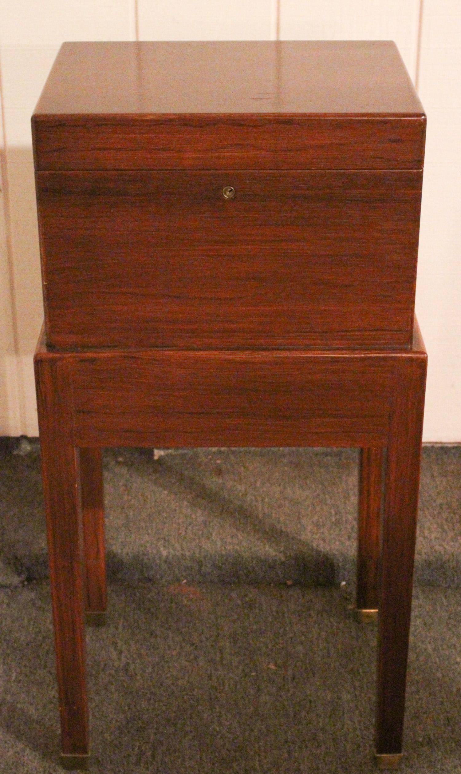 Labeled Benson and Hedges Humidor on Stand: Labeled Benson and Hedges Fifth Ave, NY Humidor on Stand. Size: 32.5" x 16" x 13" ***Please Note: This is an on-site online auction with specific Pick up terms and conditions. Pick up day is scheduled