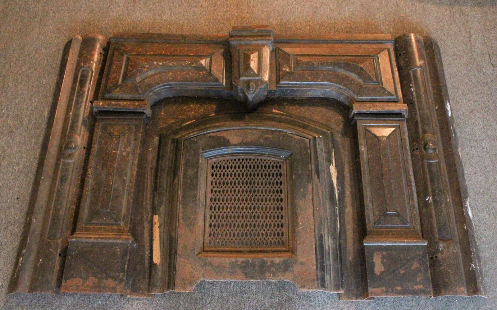 Late 19th C Cast Iron Mantel and Insert: Late 19th C Cast Iron Mantel and Insert. No lintel. Size: 47.5" x 60" x 7" ***Please Note: This is an on-site online auction with specific Pick up terms and conditions. Pick up day is scheduled for 8/