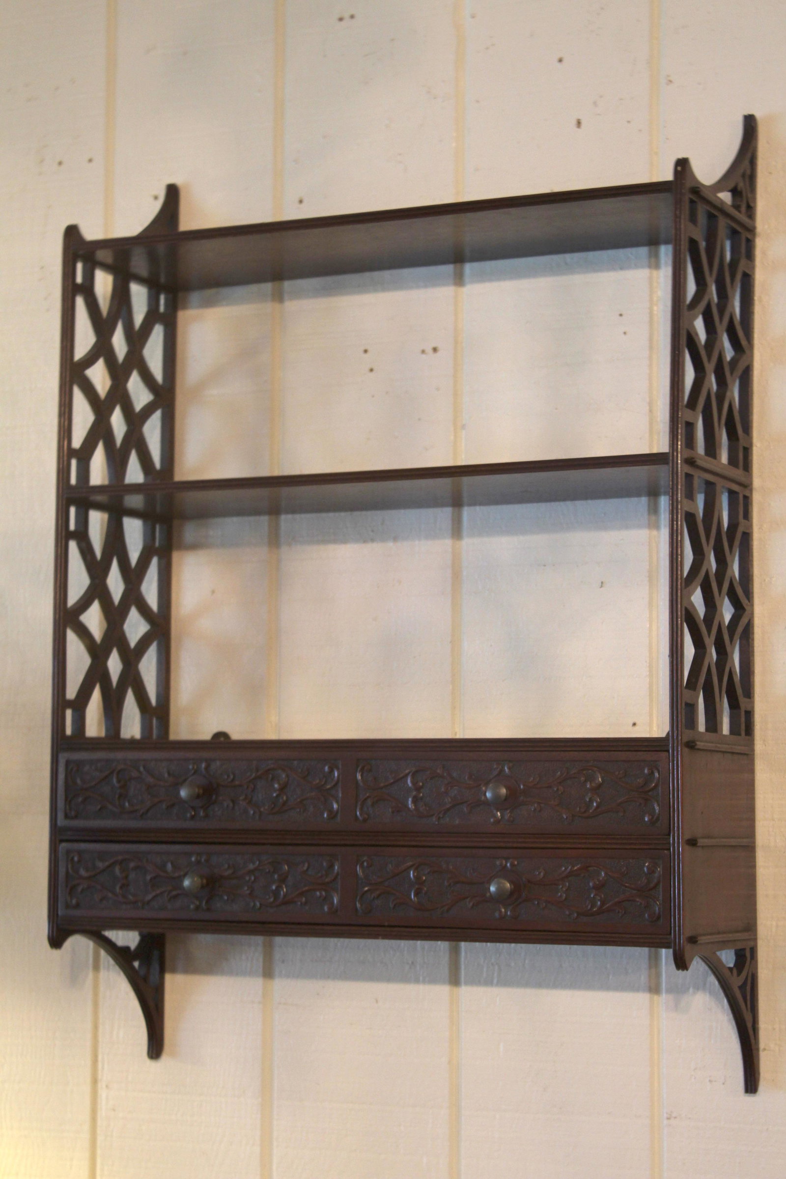 Chinese Chippendale Style Hanging Whatnot Shelf: Chinese Chippendale Style Hanging Whatnot Shelf. Fretwork sides and 2 drawers with carved fronts. Size: 35" x 25" x 8" ***Please Note: This is an on-site online auction with specific Pick up terms and