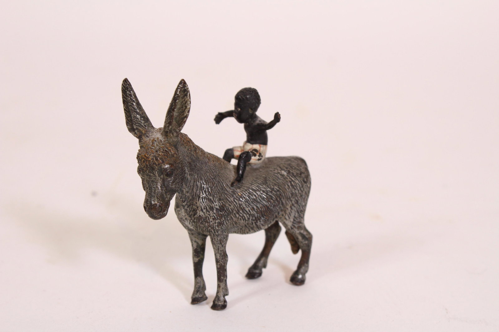 Vienna Cold Painted Bronze Boy and Donkey Group: Vienna Cold Painted Bronze Group. Size: 2.75" x 2.5" x 1" ***Please Note: This is an on-site online auction with specific Pick up terms and conditions. Pick up day is scheduled for 8/29 in Frazer, PA.