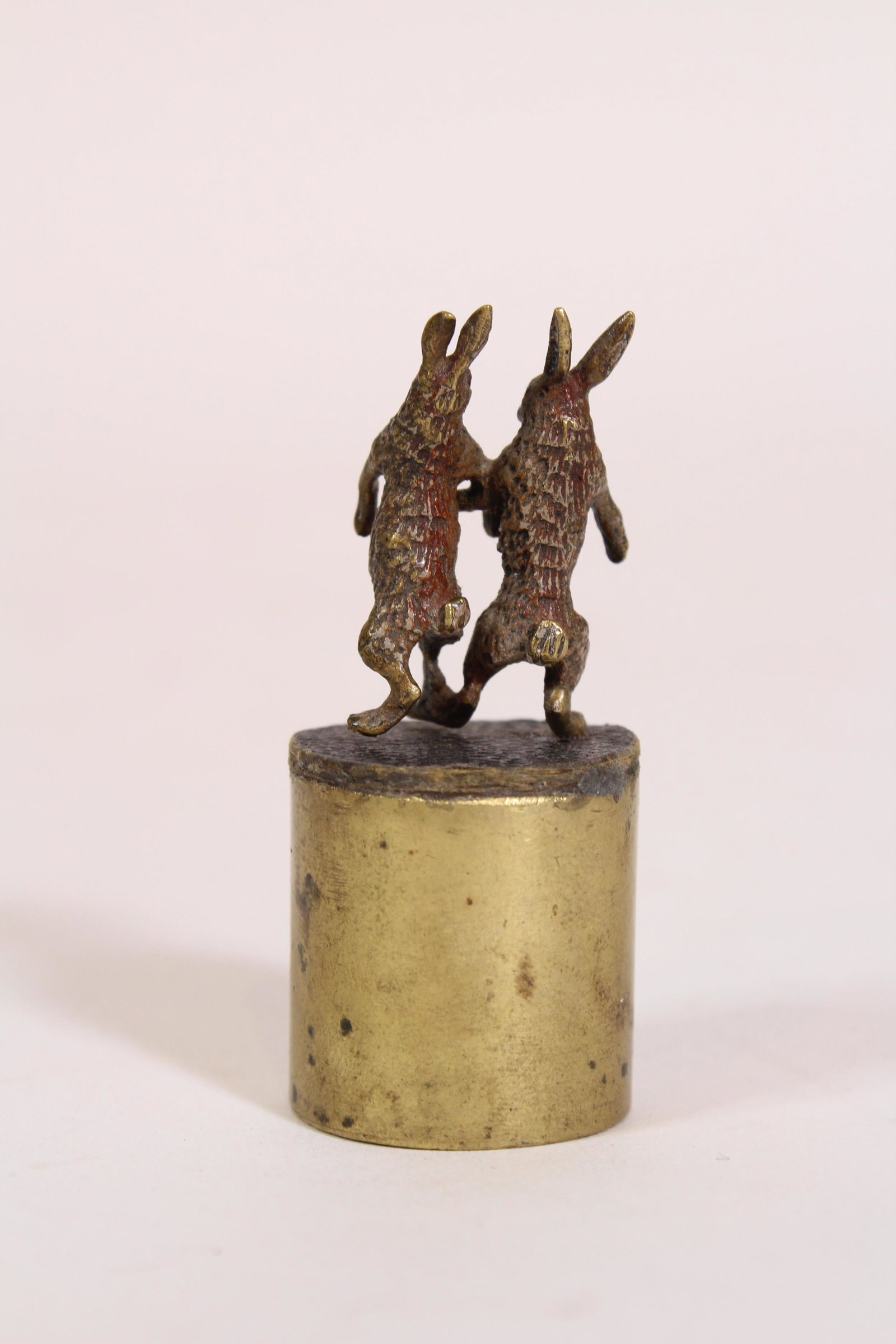 Vienna Bronze Dancing Rabbit Group: Vienna Bronze Dancing Rabbit Group. Mounted on a weight. Size: 2.5" x 1" diameter. ***Please Note: This is an on-site online auction with specific Pick up terms and conditions. Pick up day is schedule