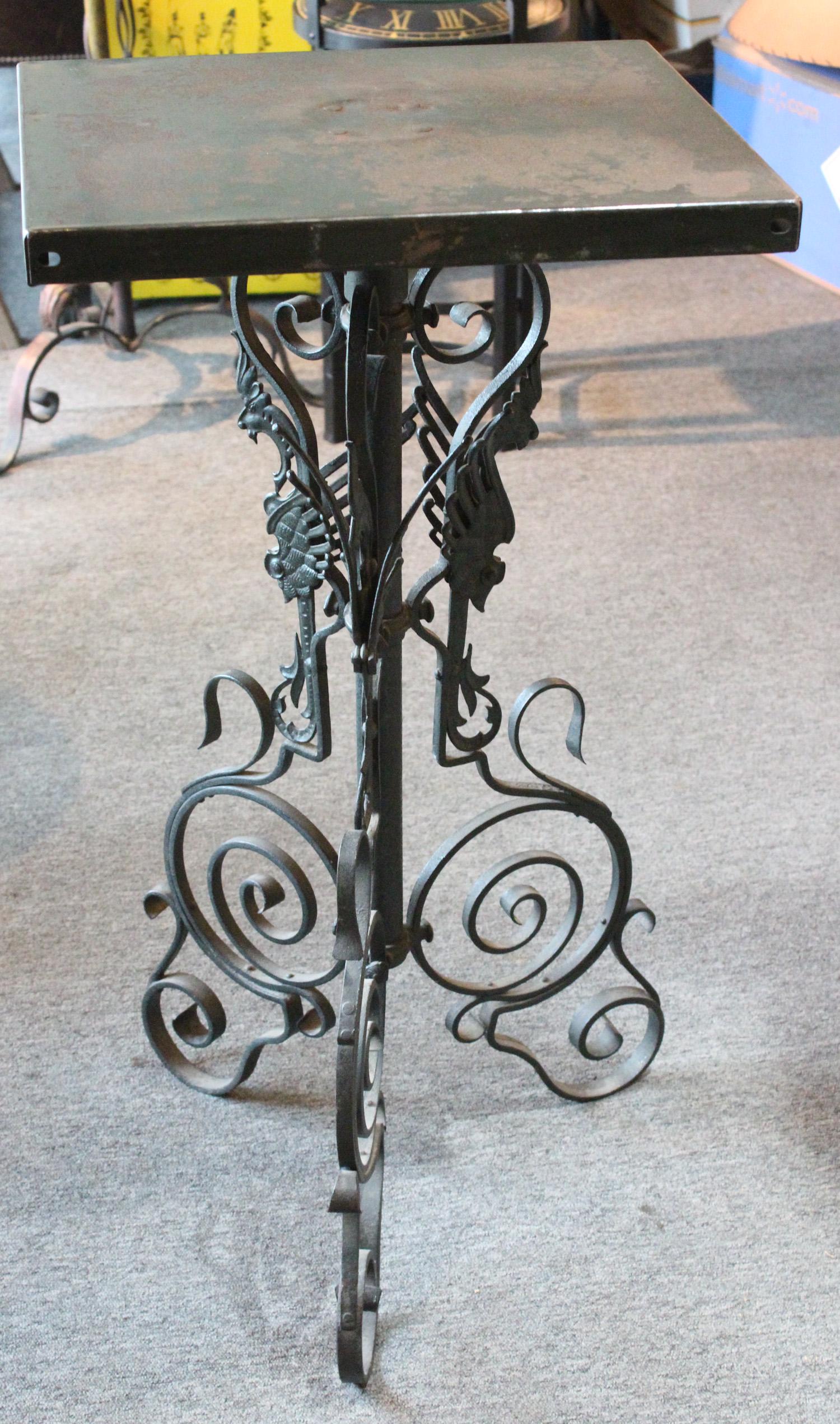 Cast and Wrought Iron Griffin Motif Pedestal: Cast and Wrought Iron Griffin Motif Pedestal. Size: 35" x 18" x 18" ***Please Note: This is an on-site online auction with specific Pick up terms and conditions. Pick up day is scheduled for 8/29 in F