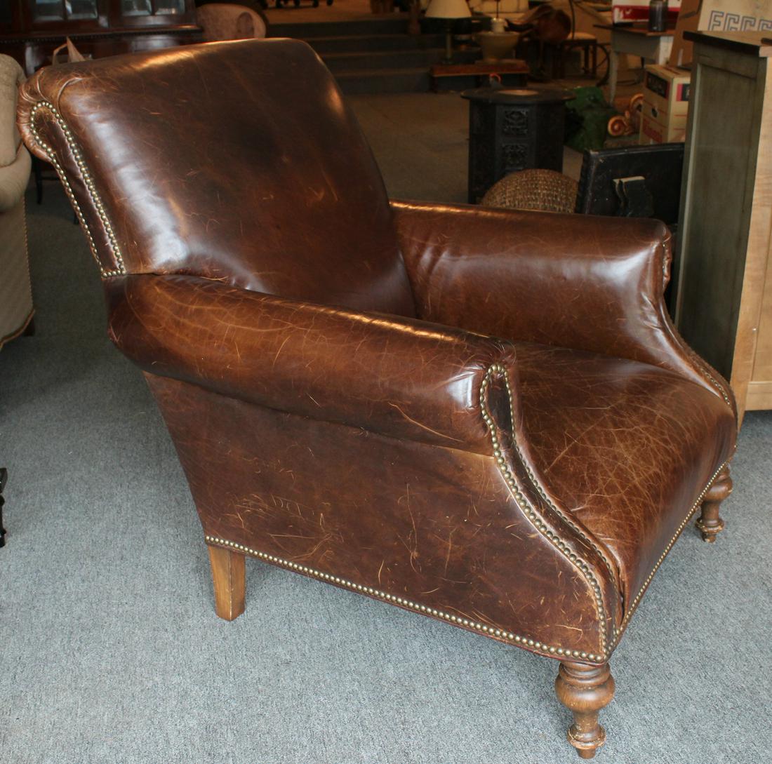 English Library Style Leather Club Chair: An English library style leather club chair with nail head decoration. Size: 39"H x 36"W x 32"D ***Please Note: This is an on-site online auction with specific Pick up terms and conditions. Pick up da