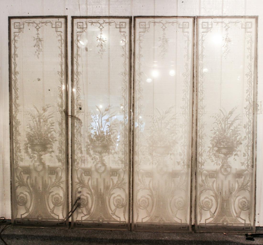 Set of 4 Frosted and Etched Glass Panels: A very good set of four turn of the century frosted and etched glass architectural panels with urn and floral design with vine garland. Size: 78"H x 22"W each ***Please Note: This is an on-site online