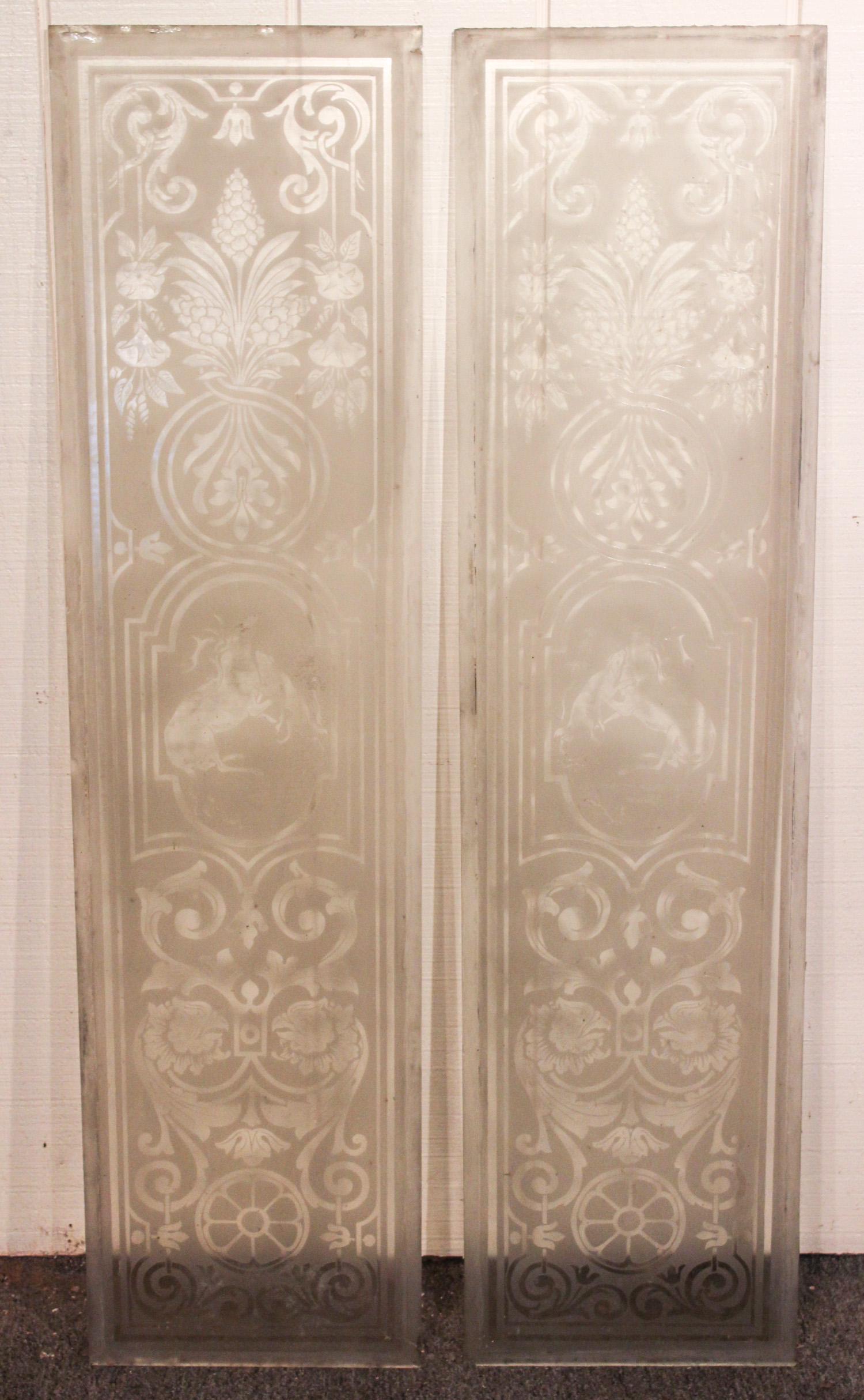 Pair of Frosted and Etched Glass Panels: A very good pair of turn of the century etched and frosted glass architectural panels with central stag and dog framed by scroll, floral and griffin decoration. Size: 46.5"H x 12"W ***Please Note: Thi